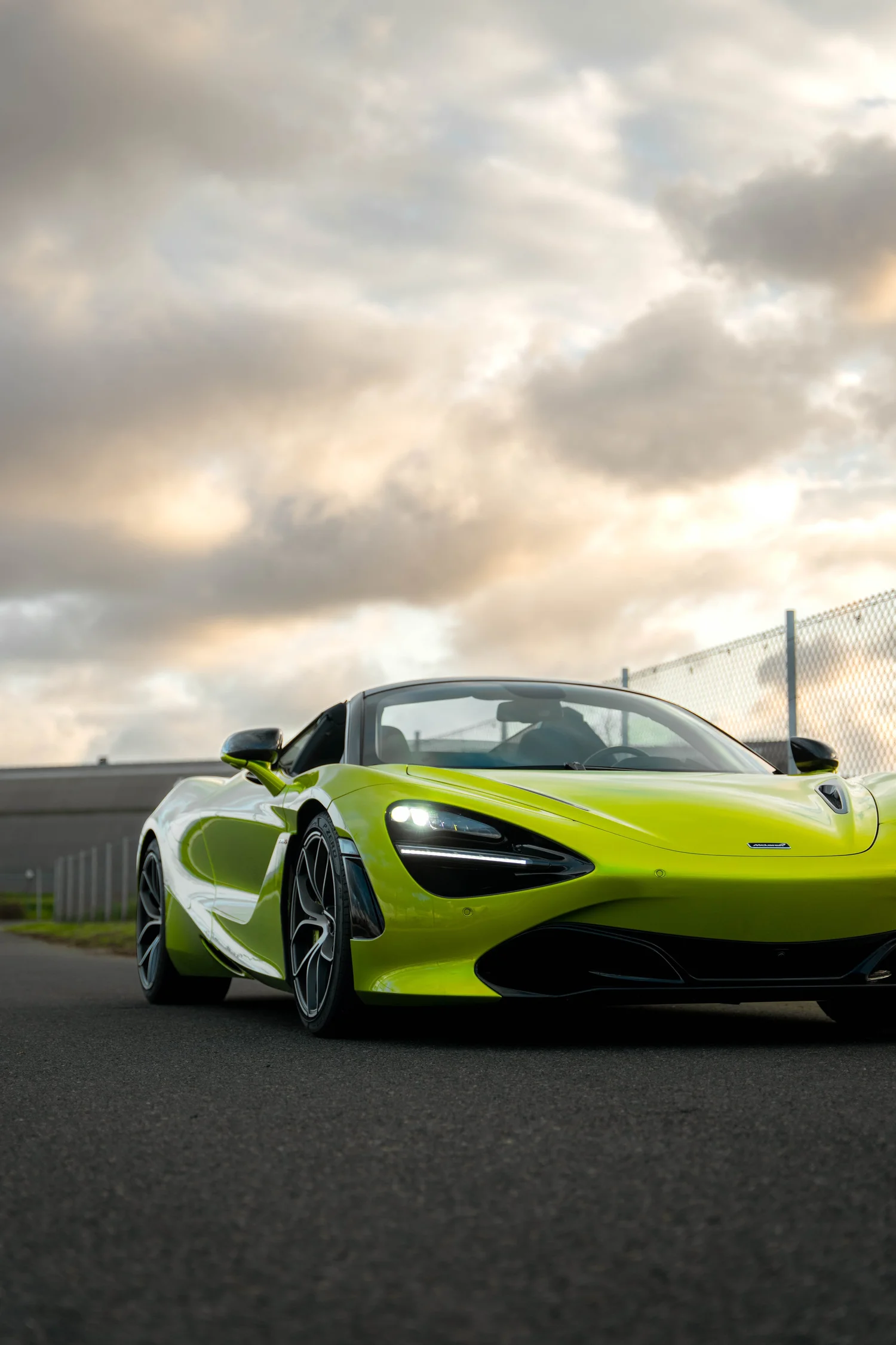 Green McLaren 720S after Paint Protection Film (PPF), Window Tint and Ceramic Coating, low-angle front view