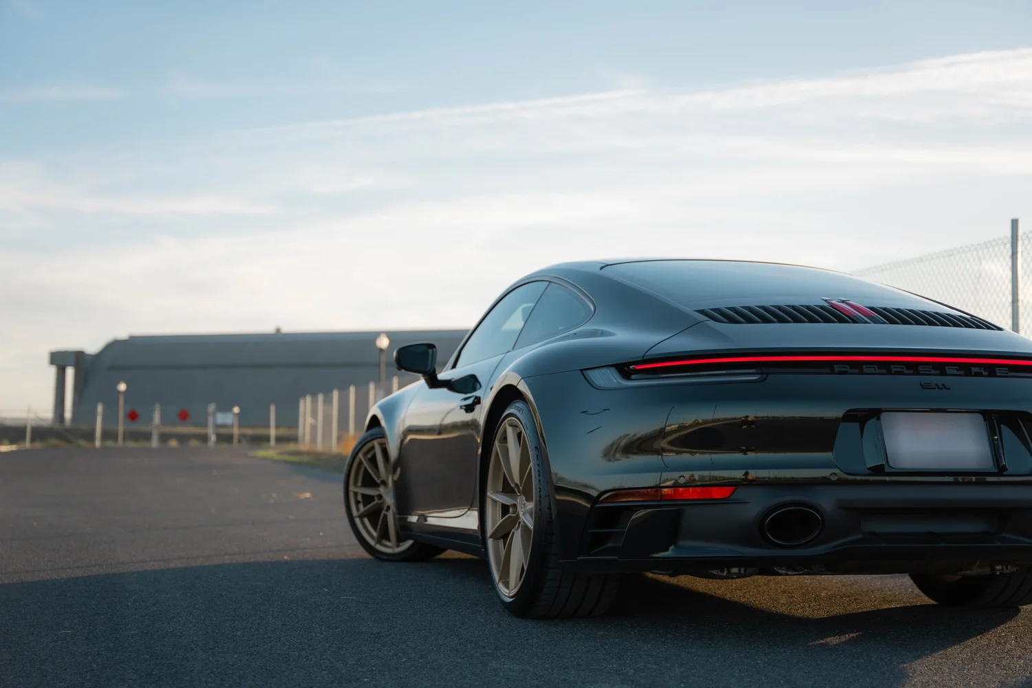 Porsche 911 Carrera Wrapped in British Green after Vinyl Wrap, rear diffuser and exhaust detail