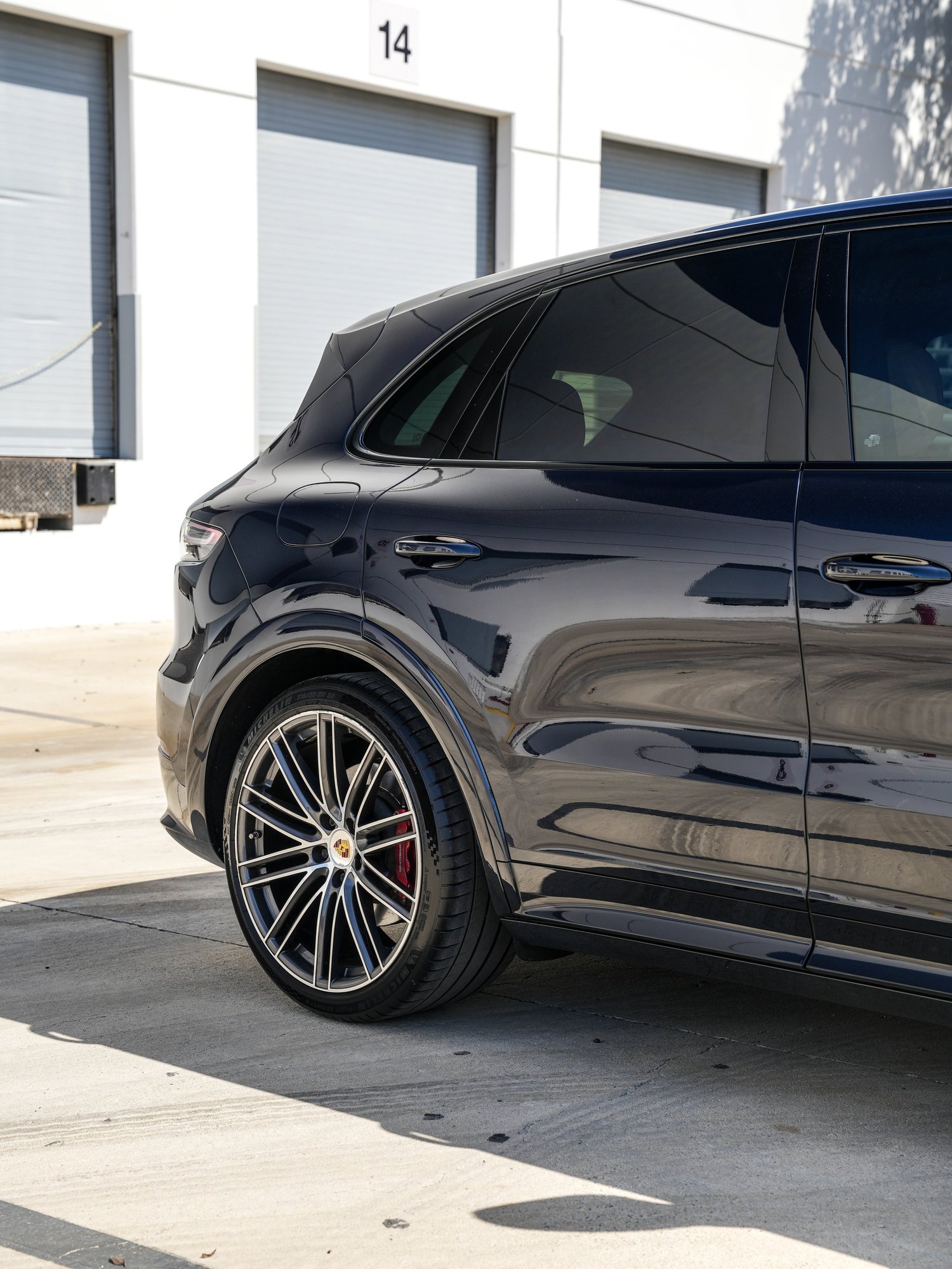 Porsche Cayenne GTS PPF after Paint Protection Film (PPF), rear-quarter and wheel view