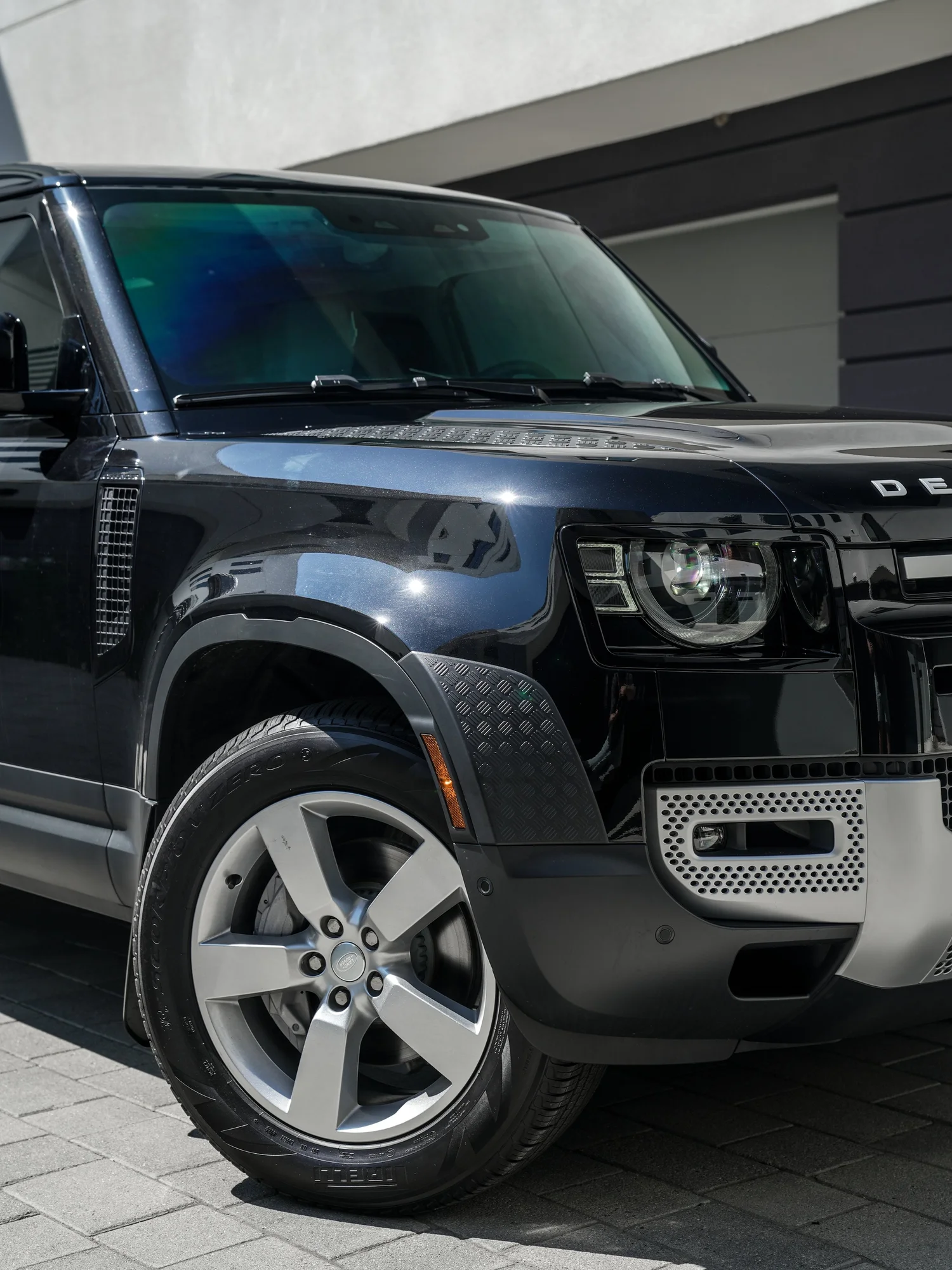 Land Rover Defender after Paint Protection Film (PPF) and Window Tint, front wheel and body view