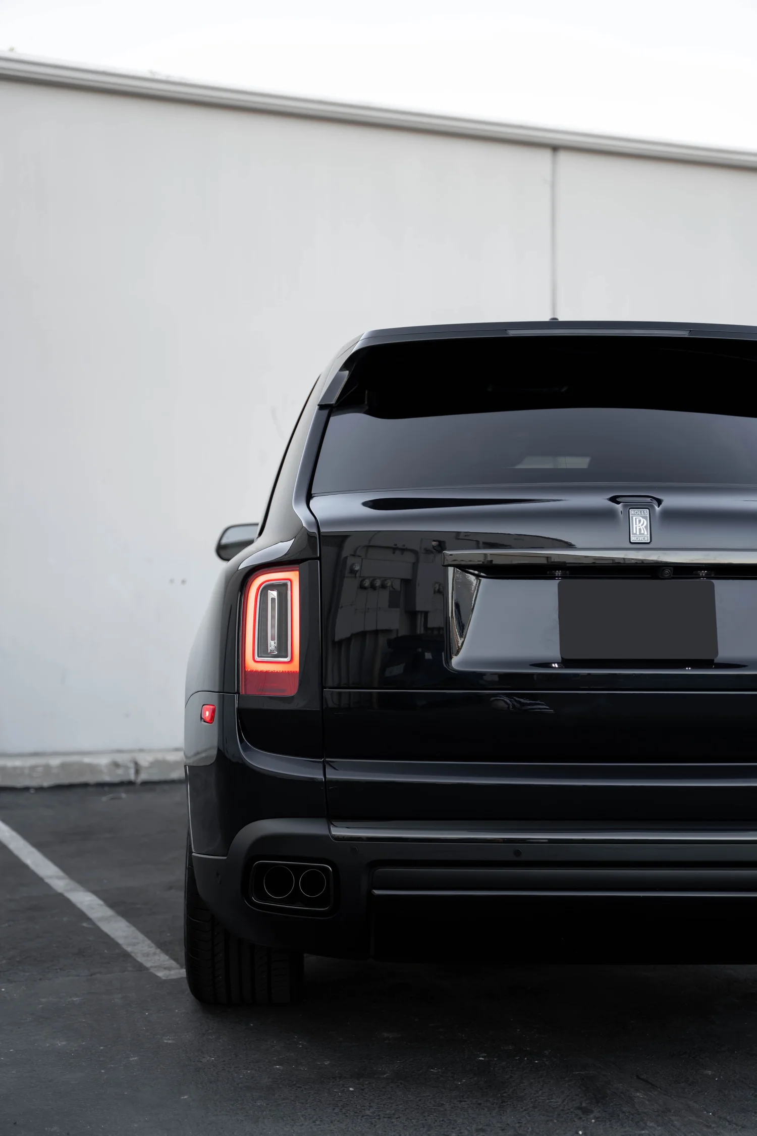 Black Rolls-Royce Cullinan Black Badge after Paint Protection Film (PPF), Window Tint and Ceramic Coating, close rear view