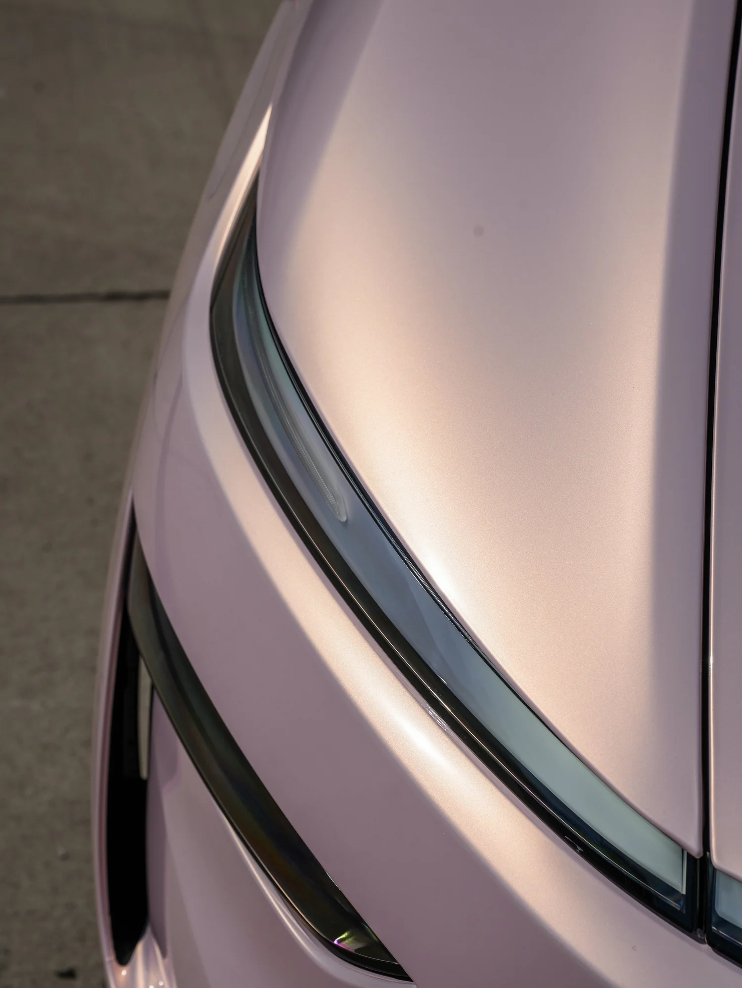 Tesla Model Y Champagne Pink after Vinyl Wrap, paint-reflection close-up
