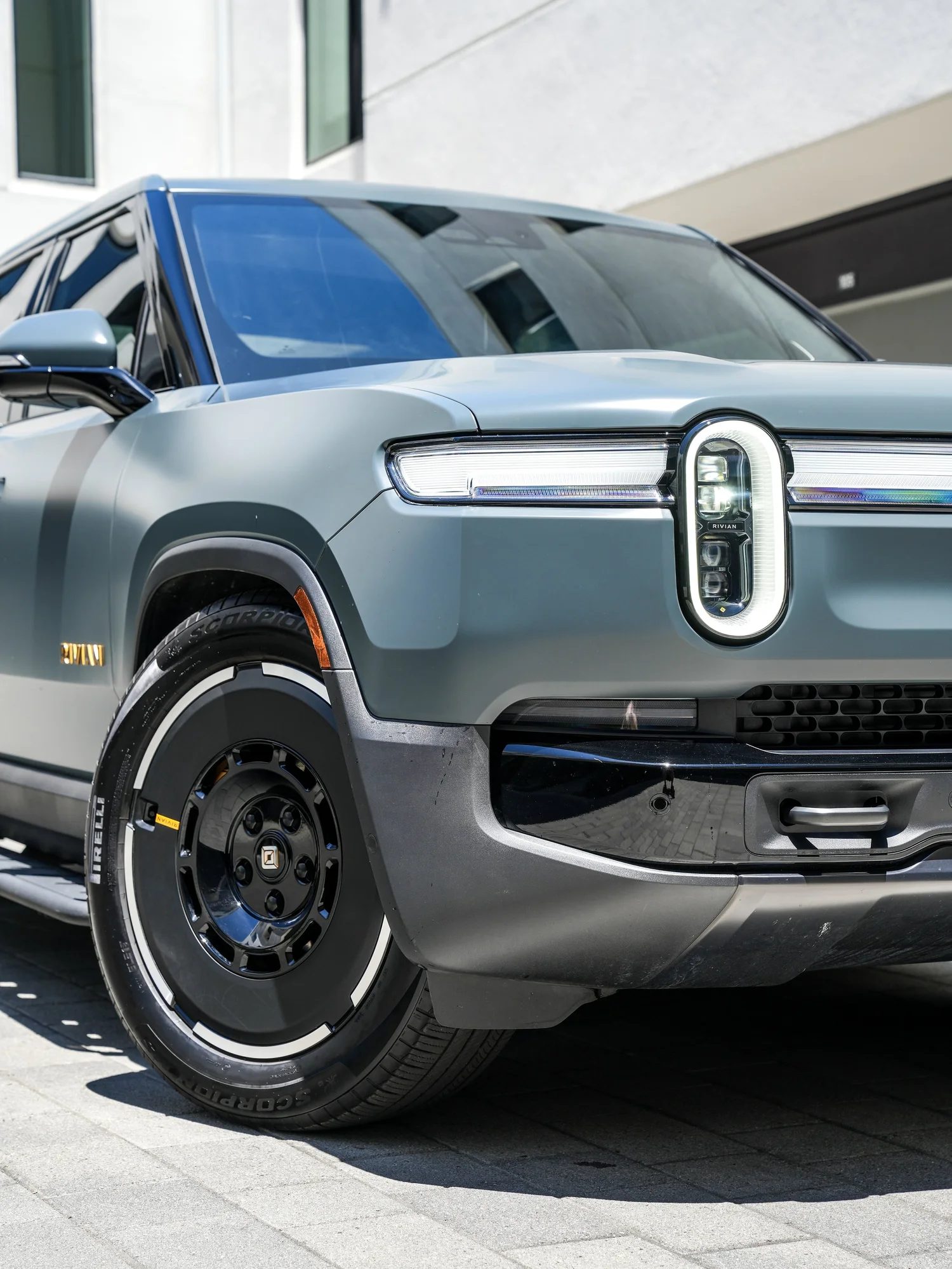 Rivian R1T after Matte PPF and Window Tint, front wheel and body view