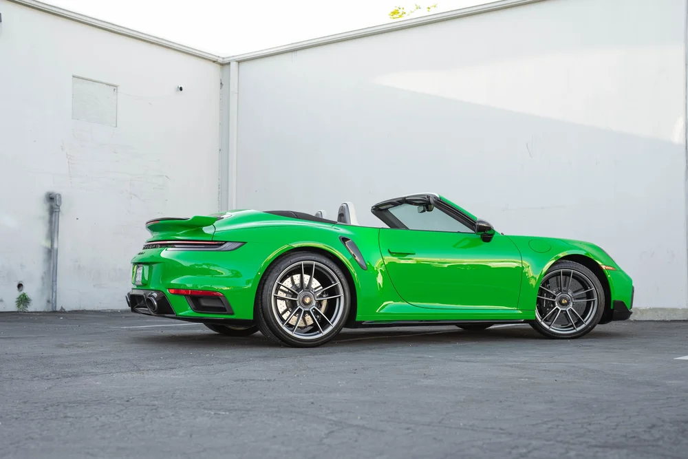 Signal Green Porsche 911 Turbo S, complete side profile with roof open and doors closed