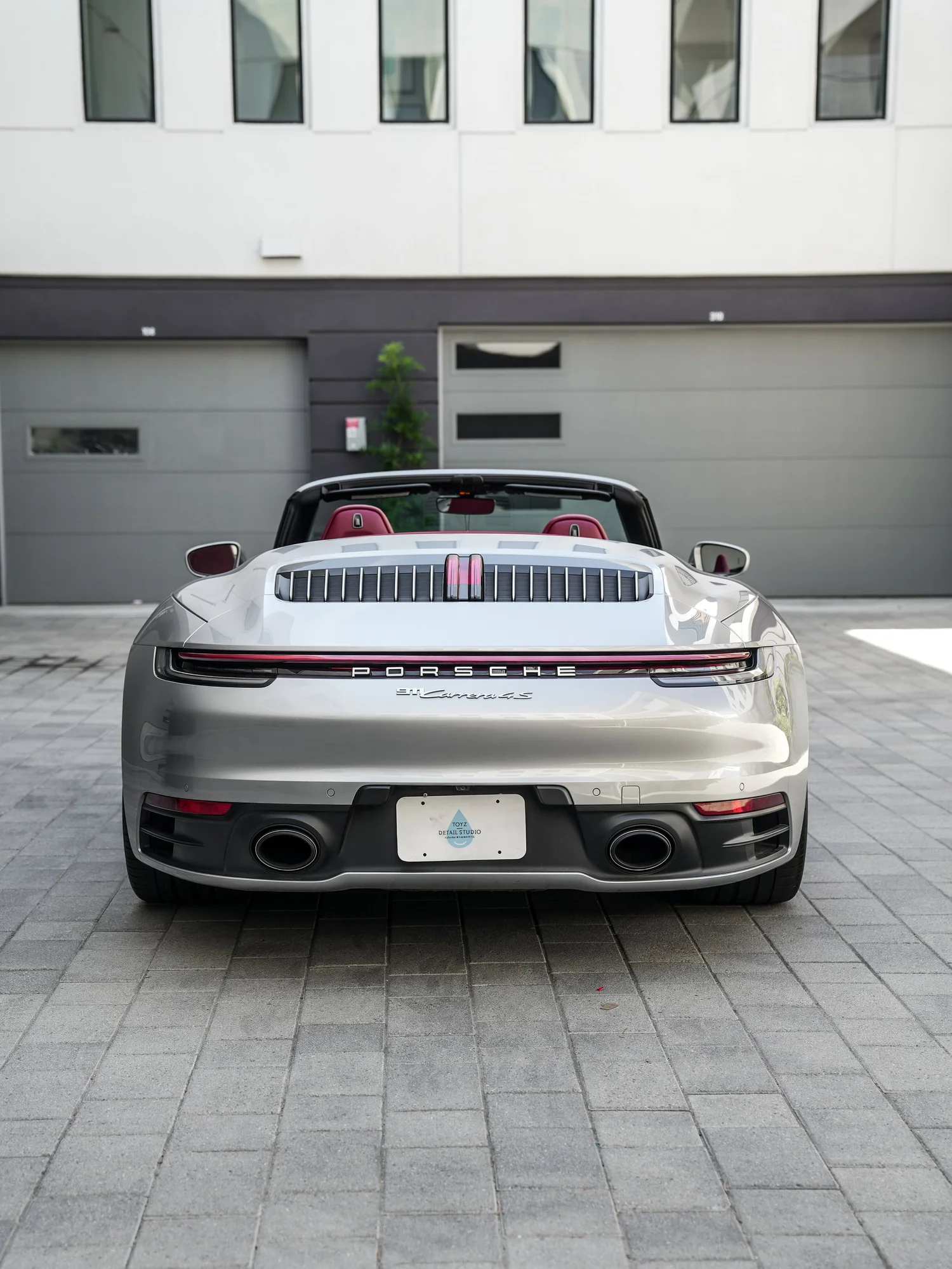 Porsche 911 after Paint Protection Film (PPF), low-angle rear view