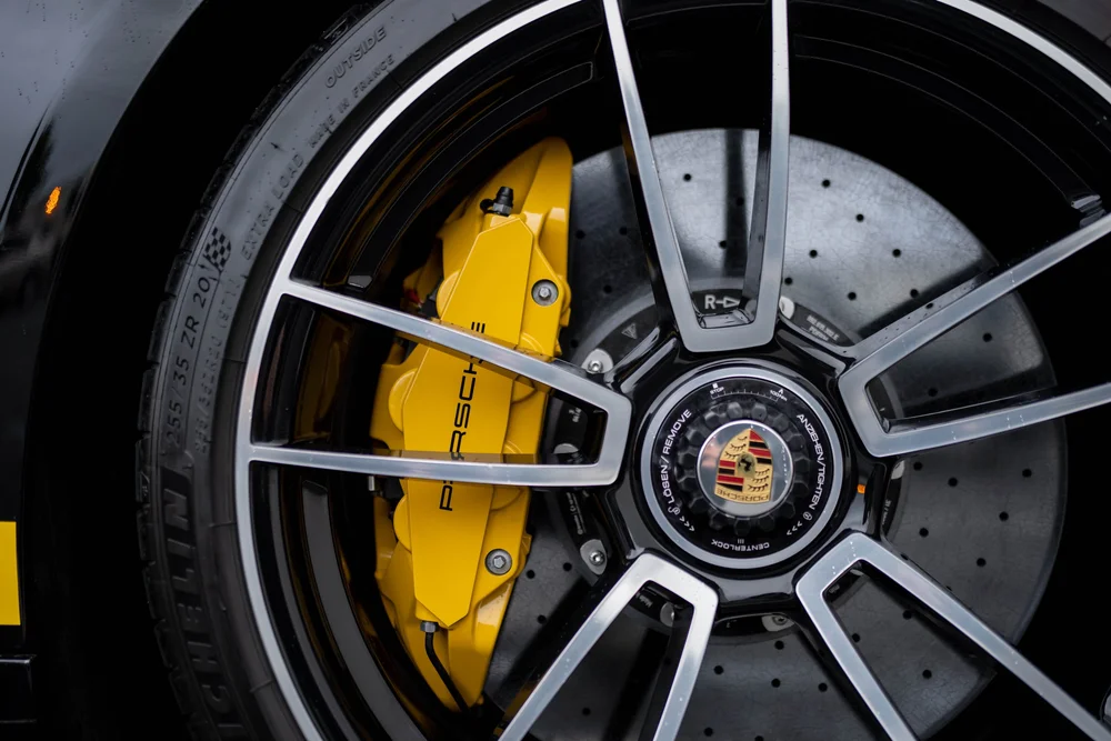 Porsche 911 Turbo S wheel with yellow caliper and drilled brake disc