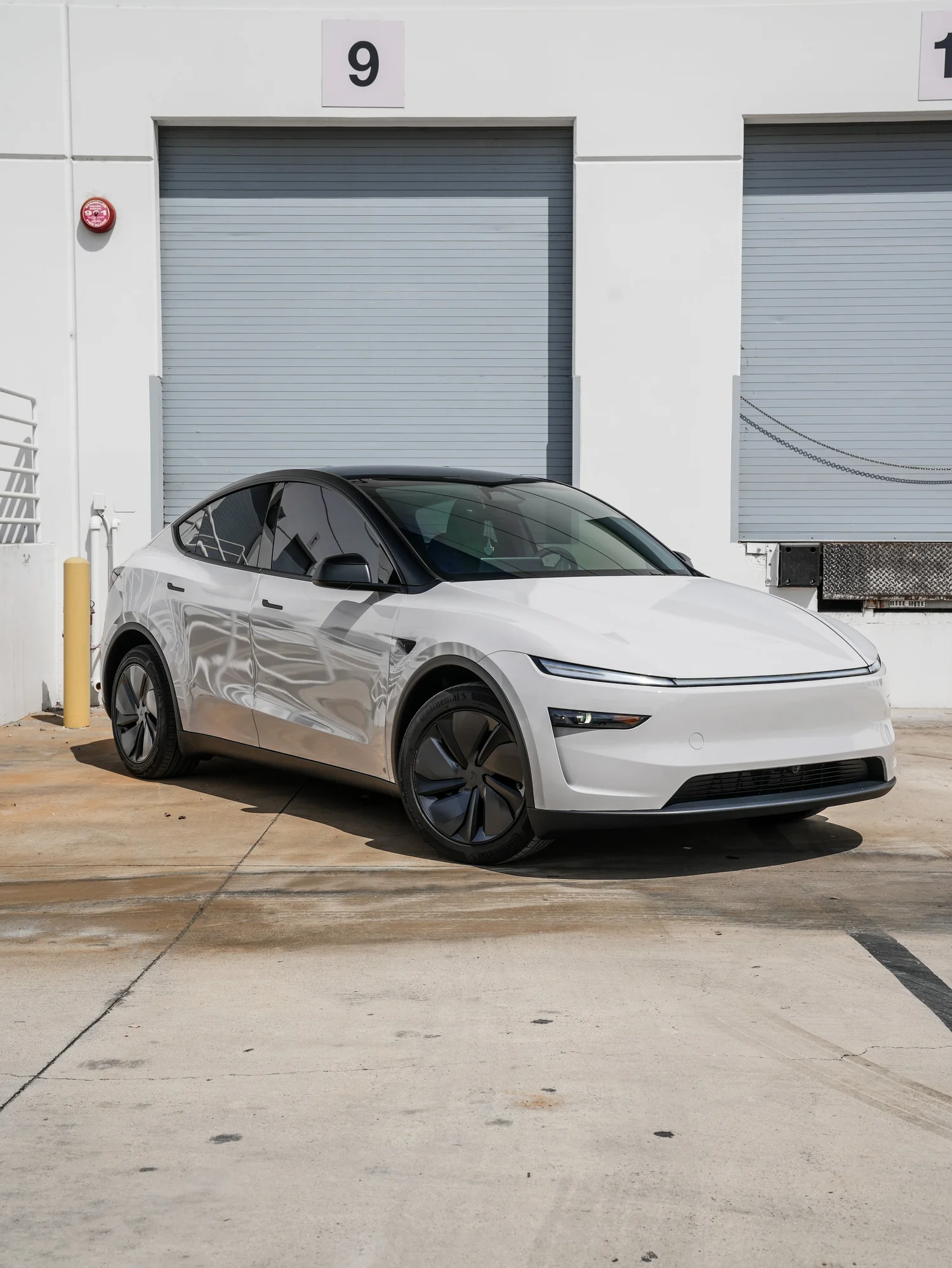 Tesla Model Y Chalk Grey Wrap after Vinyl Wrap, front-left three-quarter view