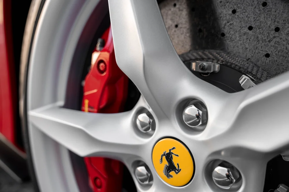 Ferrari F8 silver wheel, yellow prancing-horse centre cap and drilled brake disc