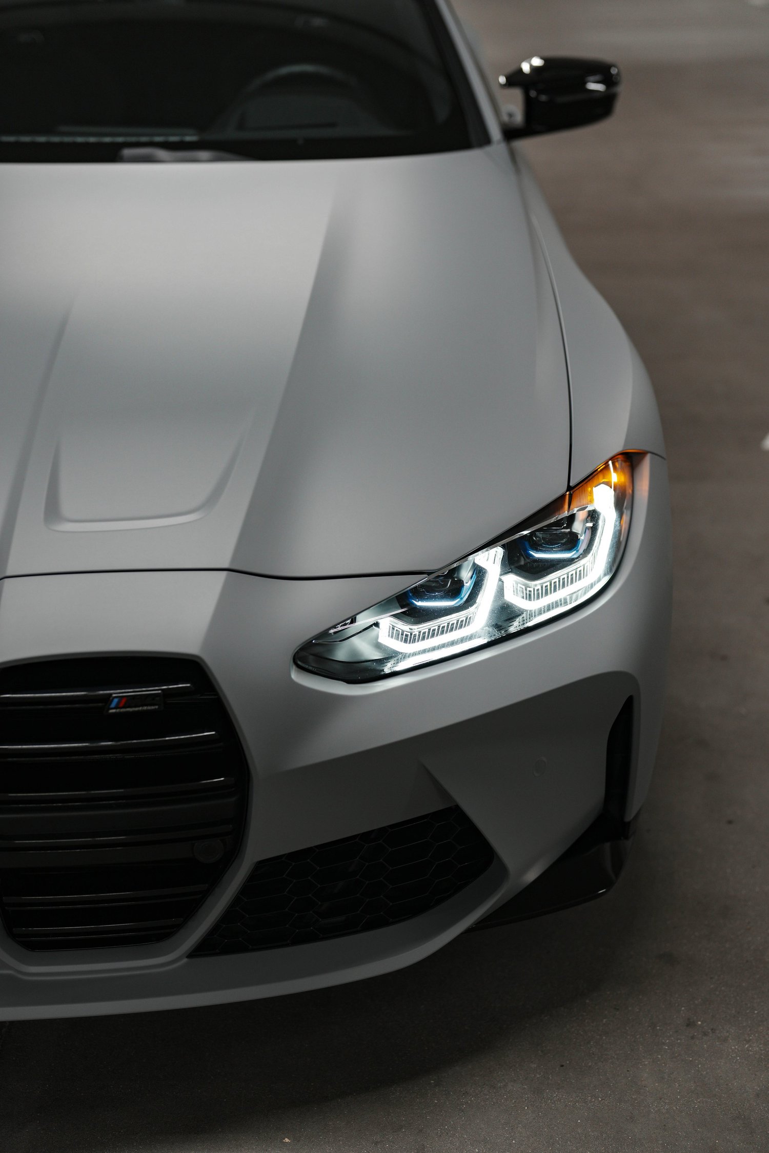 Brooklyn Grey BMW M4 after Matte PPF, Window Tint and Ceramic Coating, low-angle front view