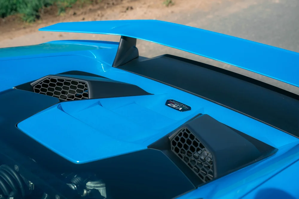 Blue Lamborghini Huracán Tecnica rear wing, engine-cover vents and glass with V10 badge