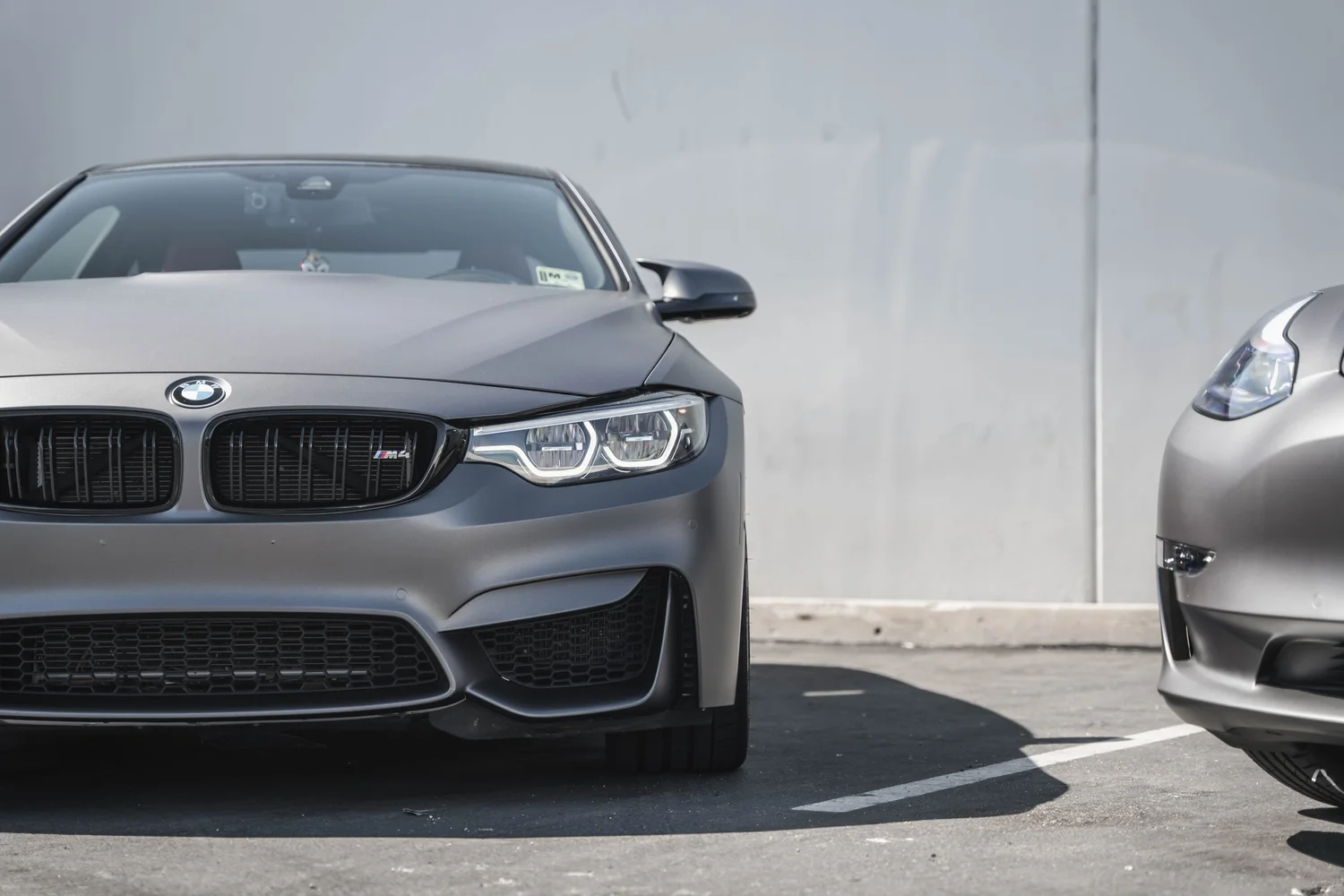 BMW M4 Matte Grey after Vinyl Wrap, tight front three-quarter view