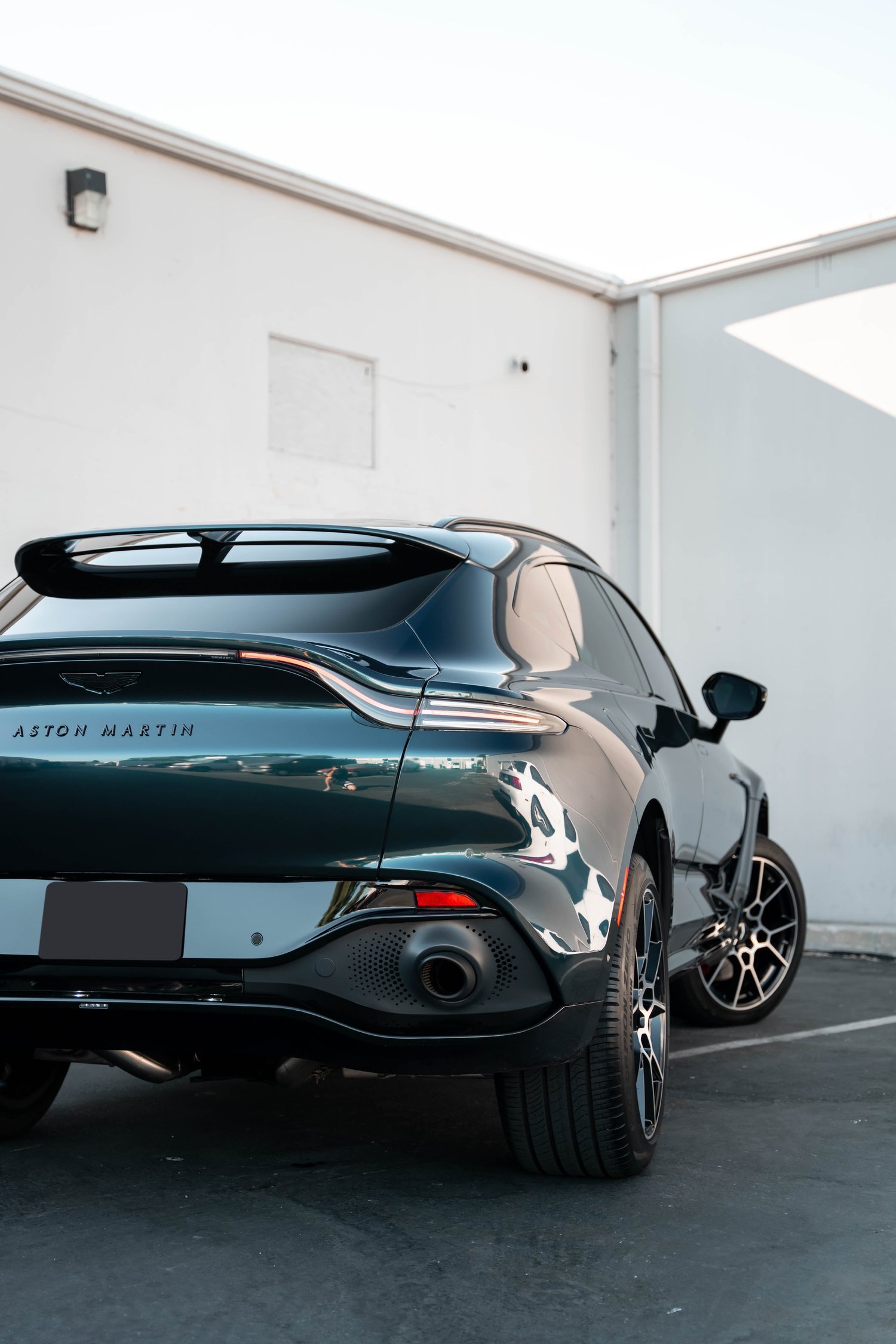 Aston Martin DBX after Paint Protection Film (PPF), Window Tint and Ceramic Coating, rear-left three-quarter view