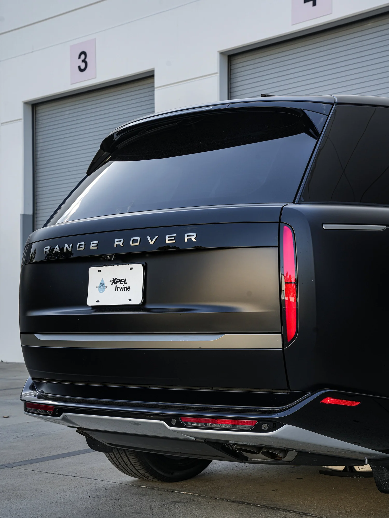 Range Rover after Matte PPF, Window Tint and Ceramic Coating, low-angle rear view