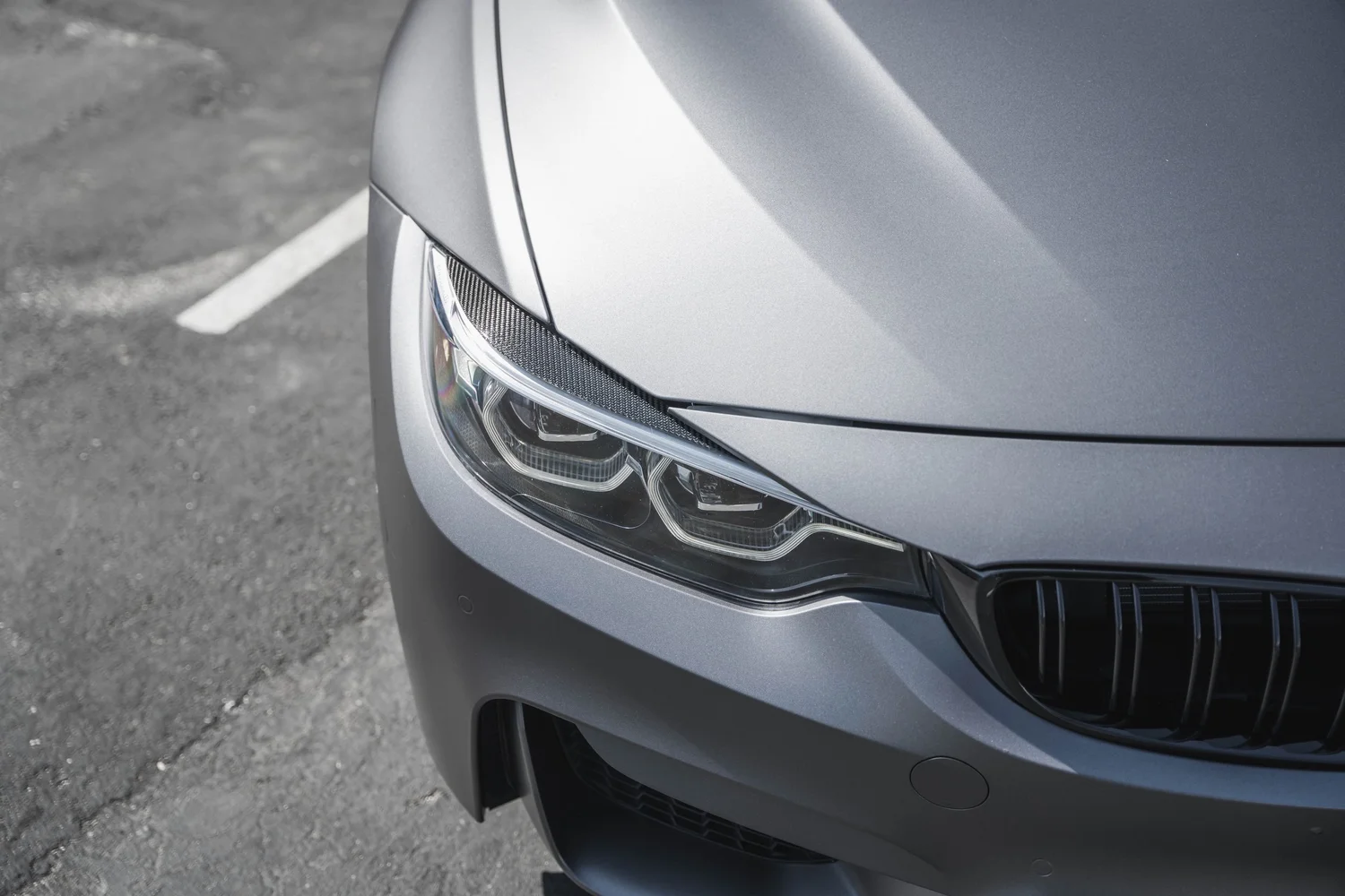 BMW M4 Matte Grey after Vinyl Wrap, front bumper and headlight detail