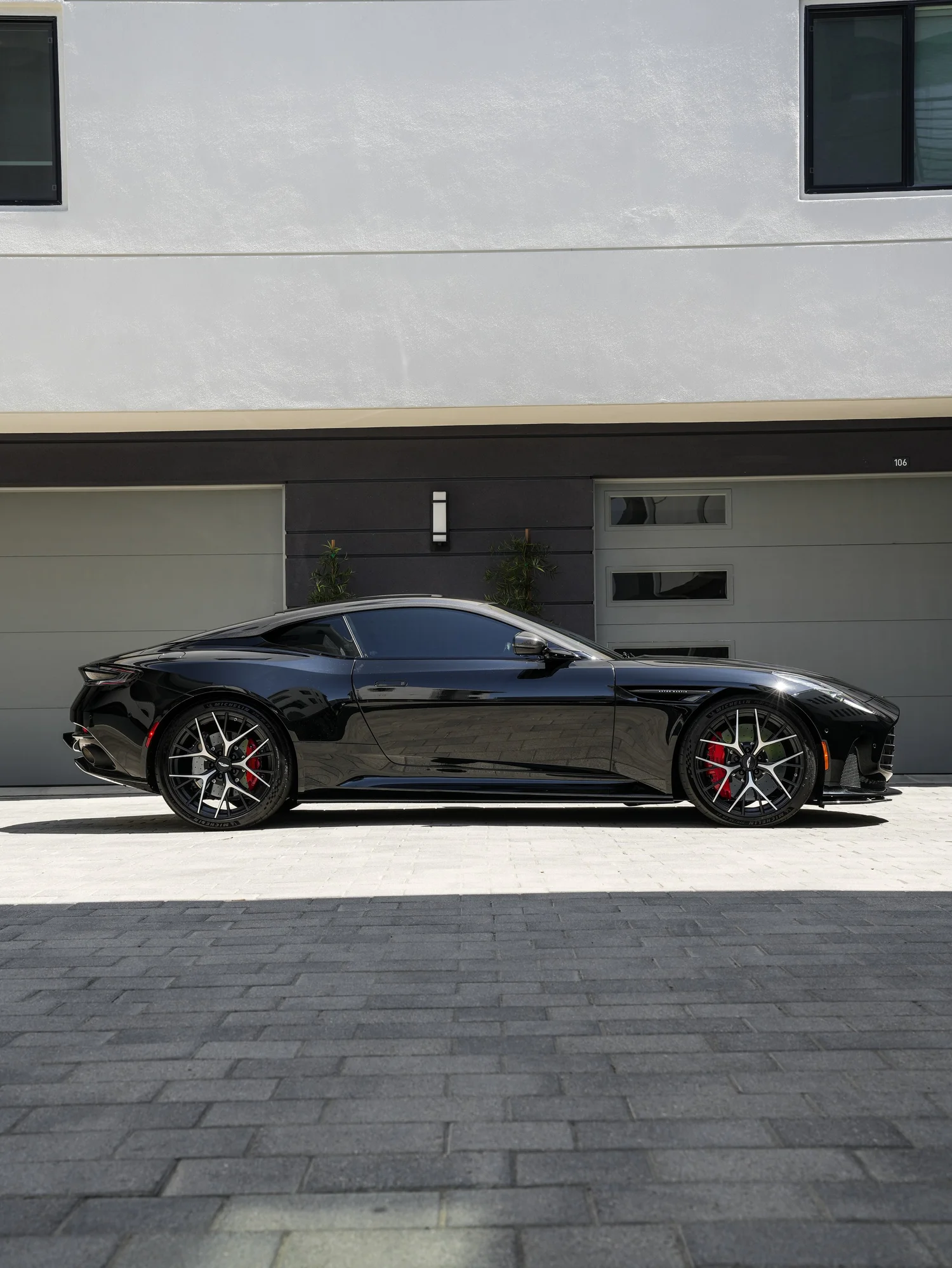 Aston Martin DB12 full passenger-side profile after full exterior PPF, window tint and ceramic coating