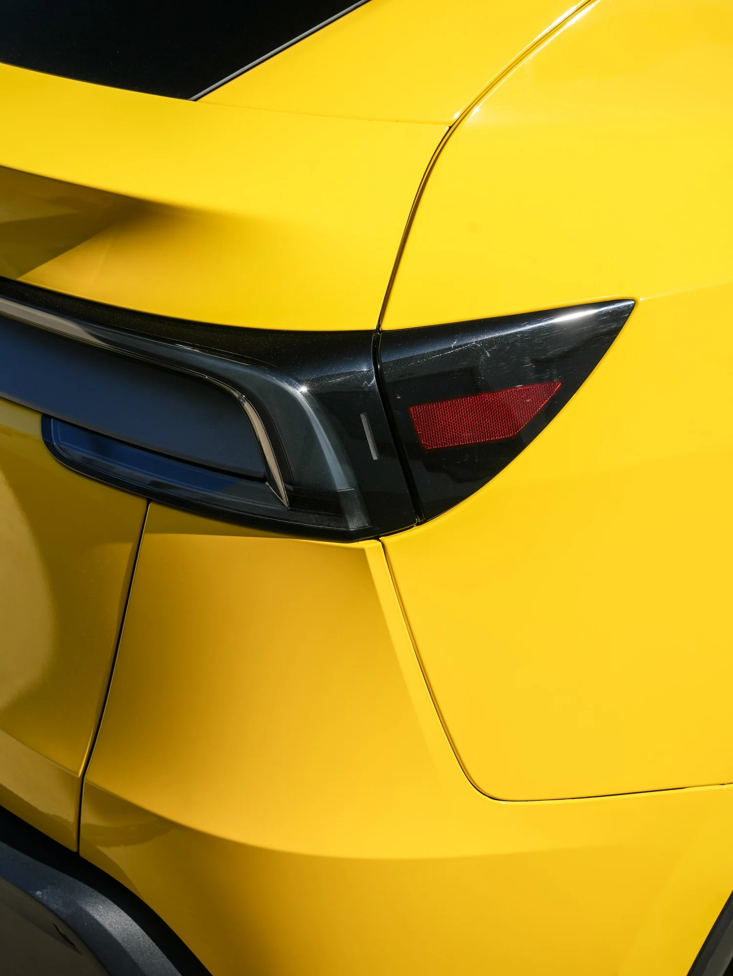 Tesla Model Y Vegas Yellow vinyl wrap, rear light detail