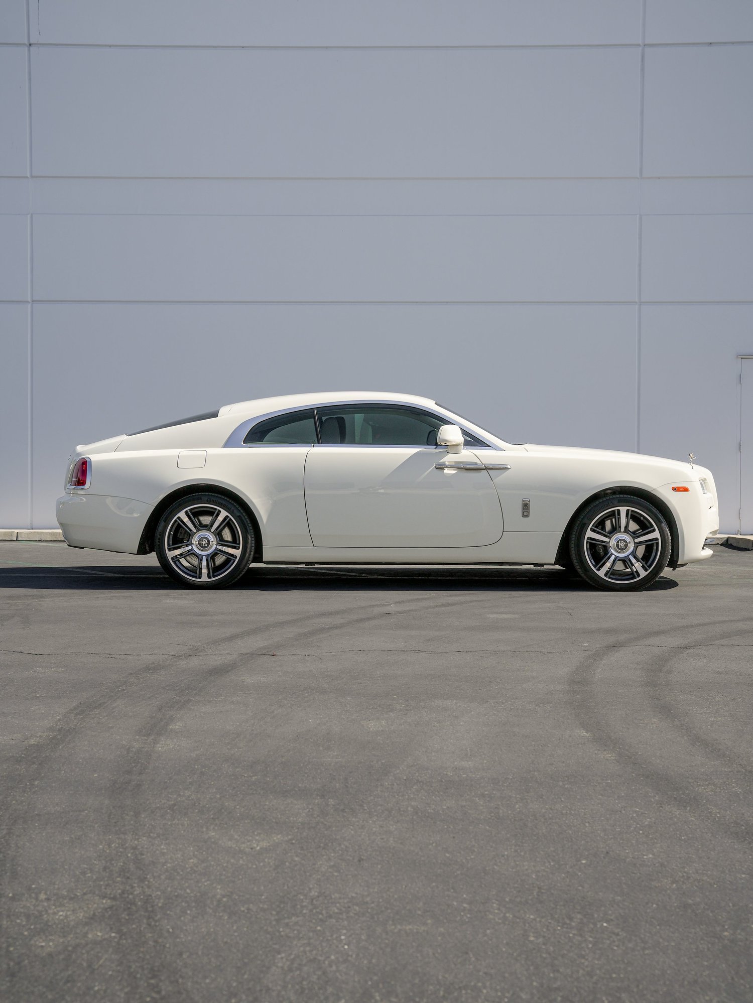 Rolls-Royce Wraith Inozetek Boneyard White after Vinyl Wrap, rear-right three-quarter view