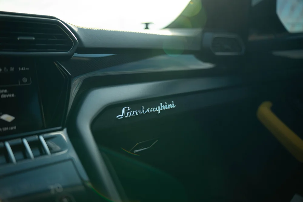 Lamborghini Urus with Chalk vinyl wrap, Lamborghini dashboard lettering beside upper vents
