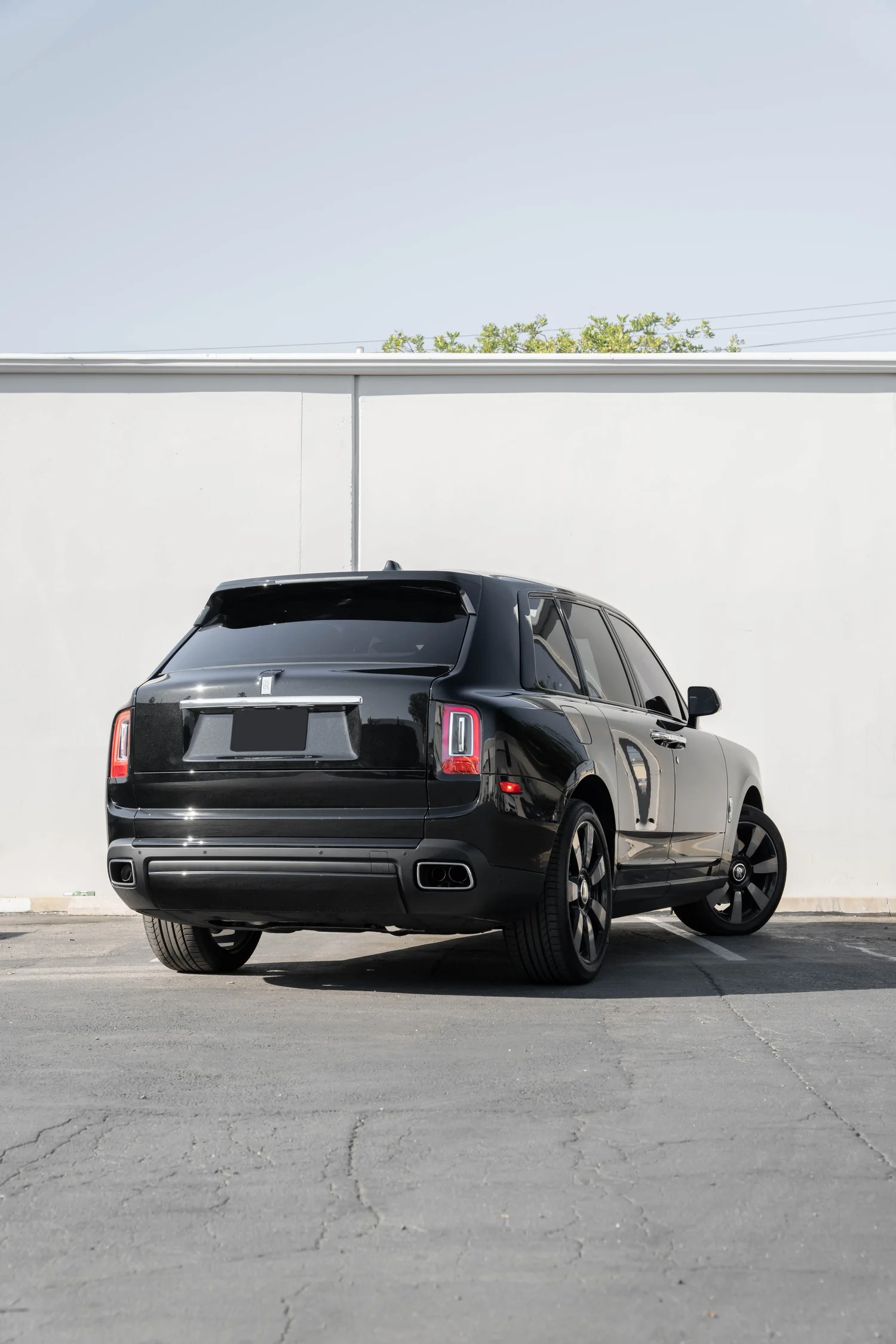Dark Metallic Grey Rolls-Royce Cullinan after Paint Protection Film (PPF), Window Tint and Ceramic Coating, rear-right three-quarter view
