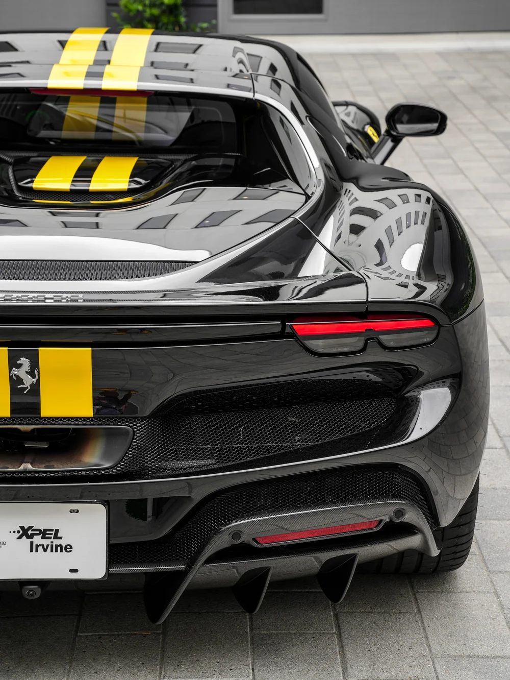 Ferrari 296 GTB rear-corner bodywork, taillight and yellow stripe detail