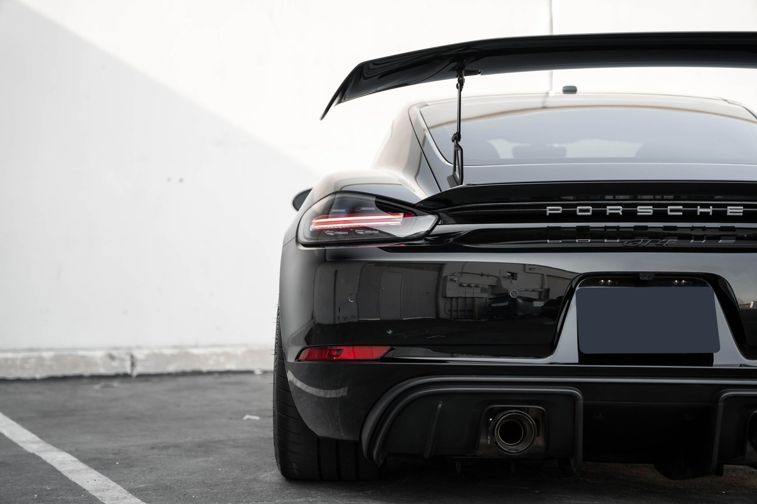 Porsche 718 Cayman GT4 after Paint Protection Film (PPF), Window Tint and Ceramic Coating, rear body and taillight view