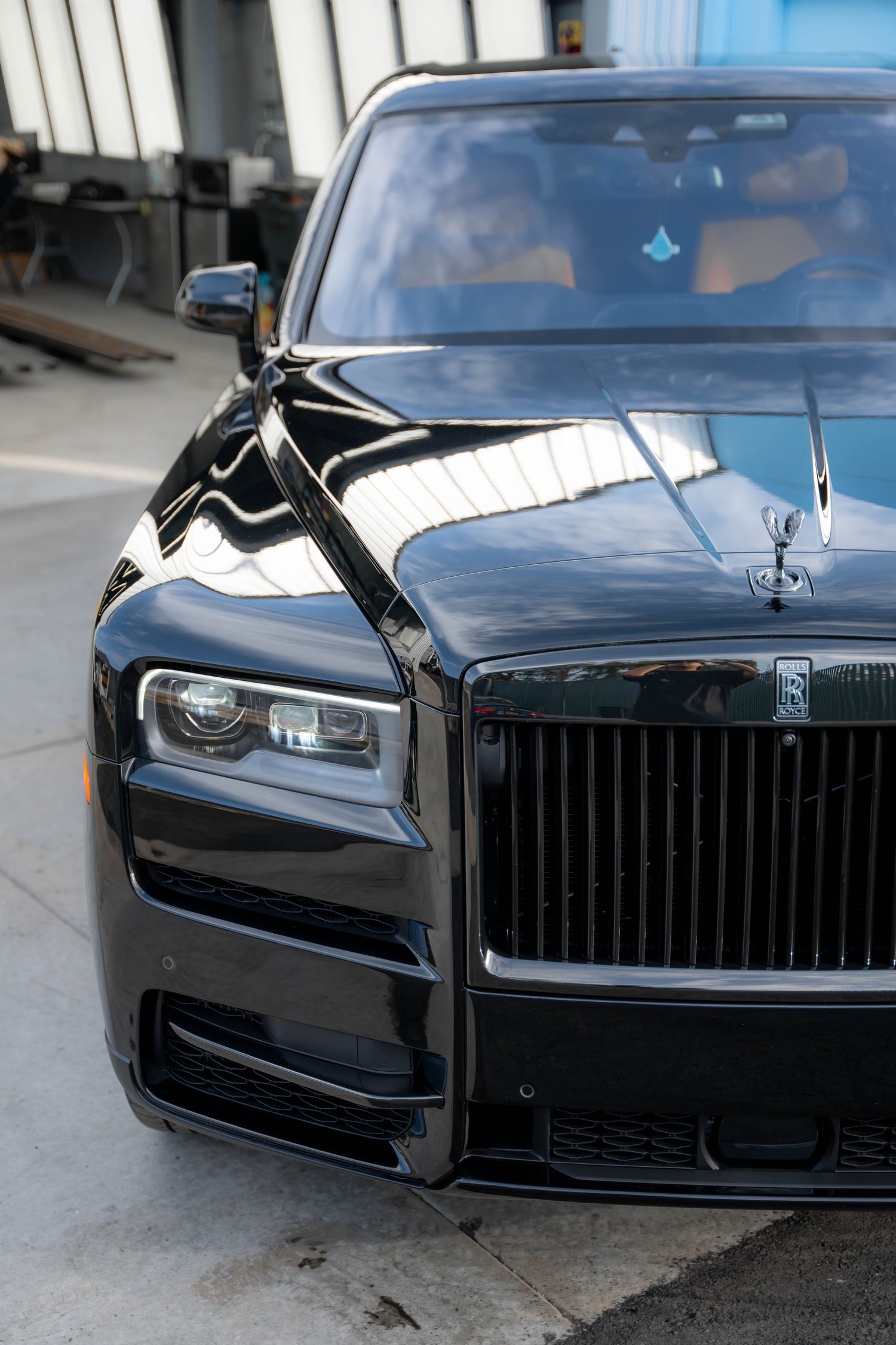 Black Rolls-Royce Cullinan Black Badge with Yellow Brake Calipers after Paint Protection Film (PPF), Window Tint and Ceramic Coating, front-corner view