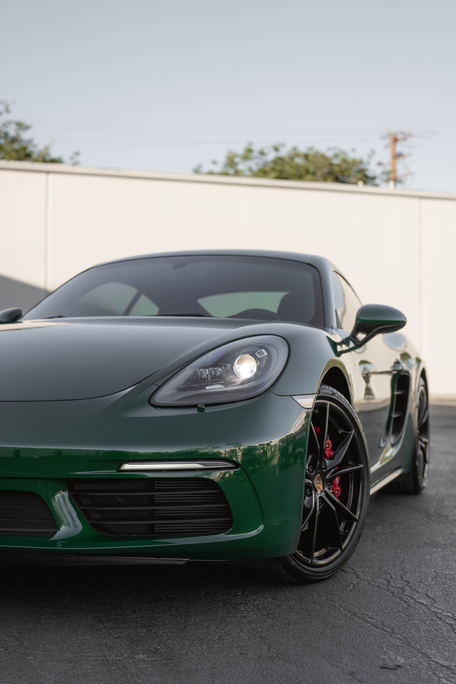 Porsche 718 Cayman S Racing Green after Vinyl Wrap, direct front view
