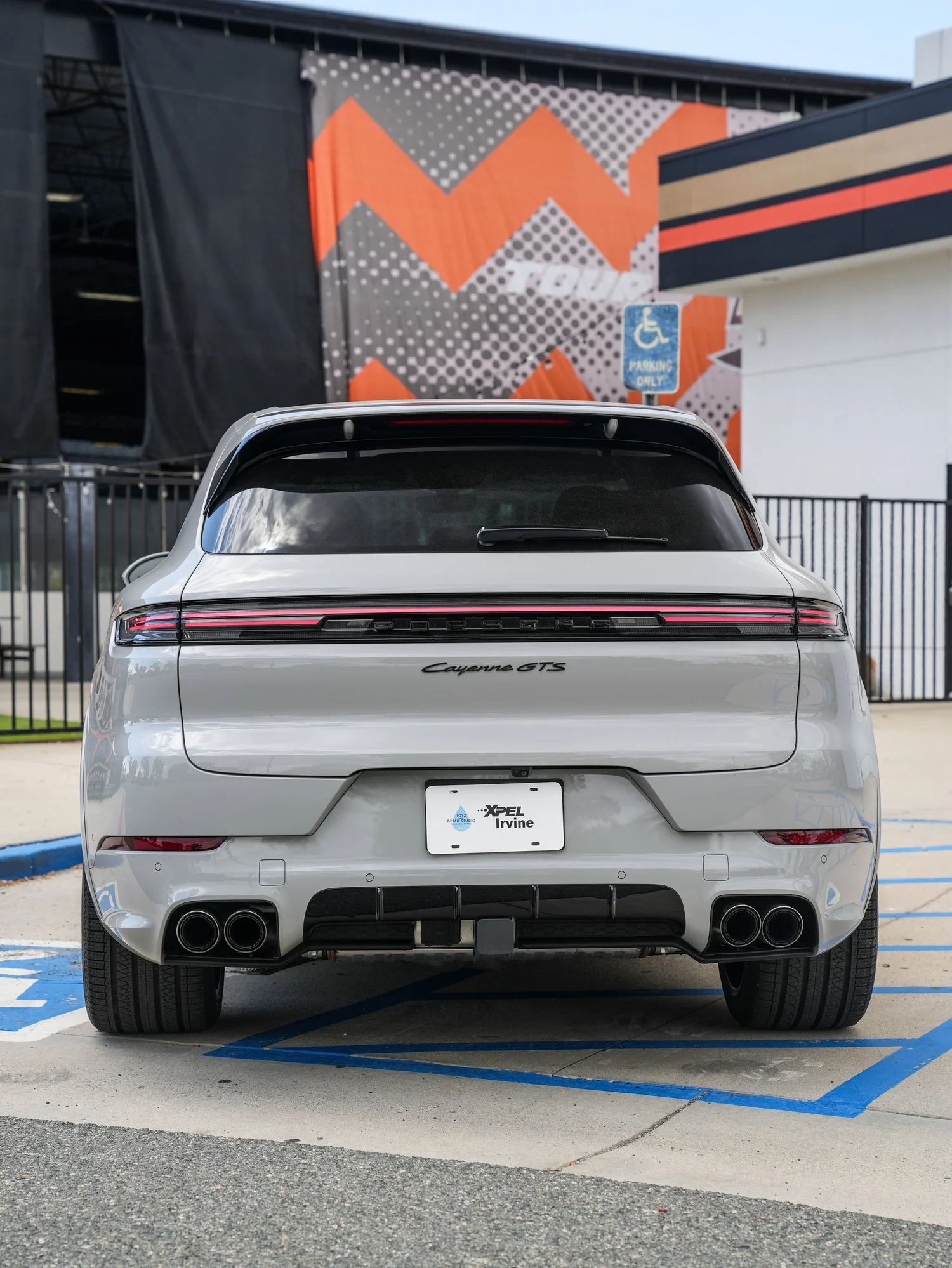 Light Grey Porsche Cayenne GTS after Paint Protection Film (PPF), Window Tint and Ceramic Coating, low-angle rear view