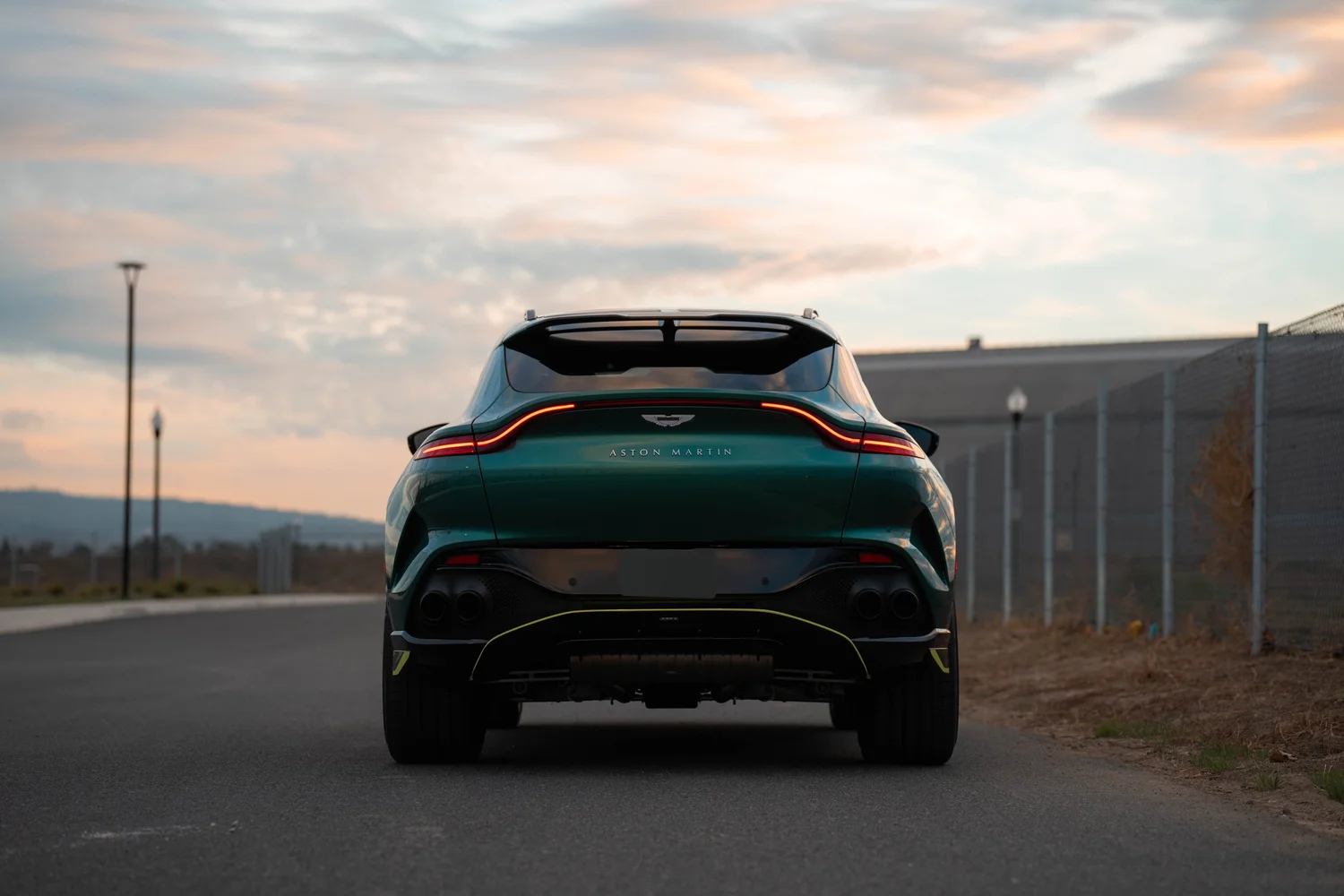 British Green Aston Martin DBX 707 after Paint Protection Film (PPF), Window Tint and Ceramic Coating, wide rear three-quarter view