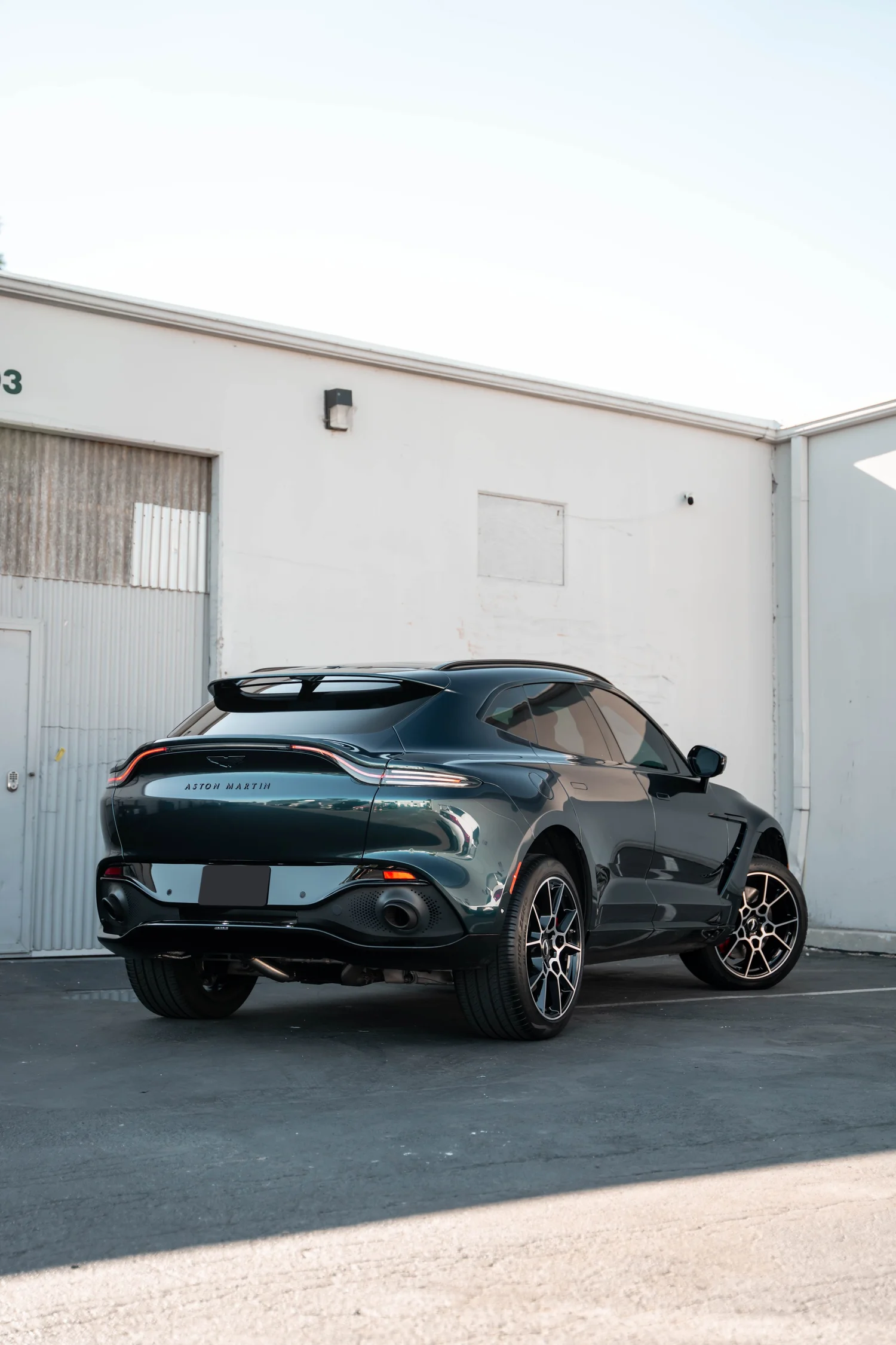 Aston Martin DBX after Paint Protection Film (PPF), Window Tint and Ceramic Coating, wide rear three-quarter view