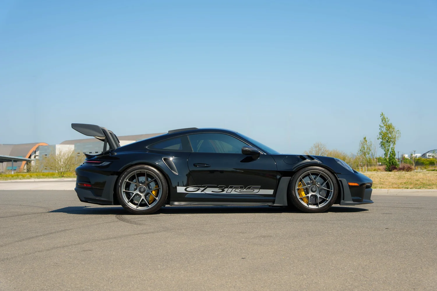 Black Porsche 992.1 GT3 RS side profile with full-body XPEL PPF