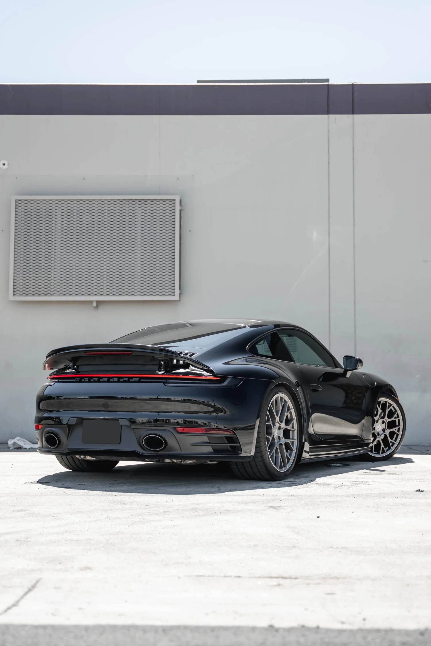 Porsche 911 Carrera S (992.1) after Paint Protection Film (PPF) and Ceramic Coating, rear-left three-quarter view