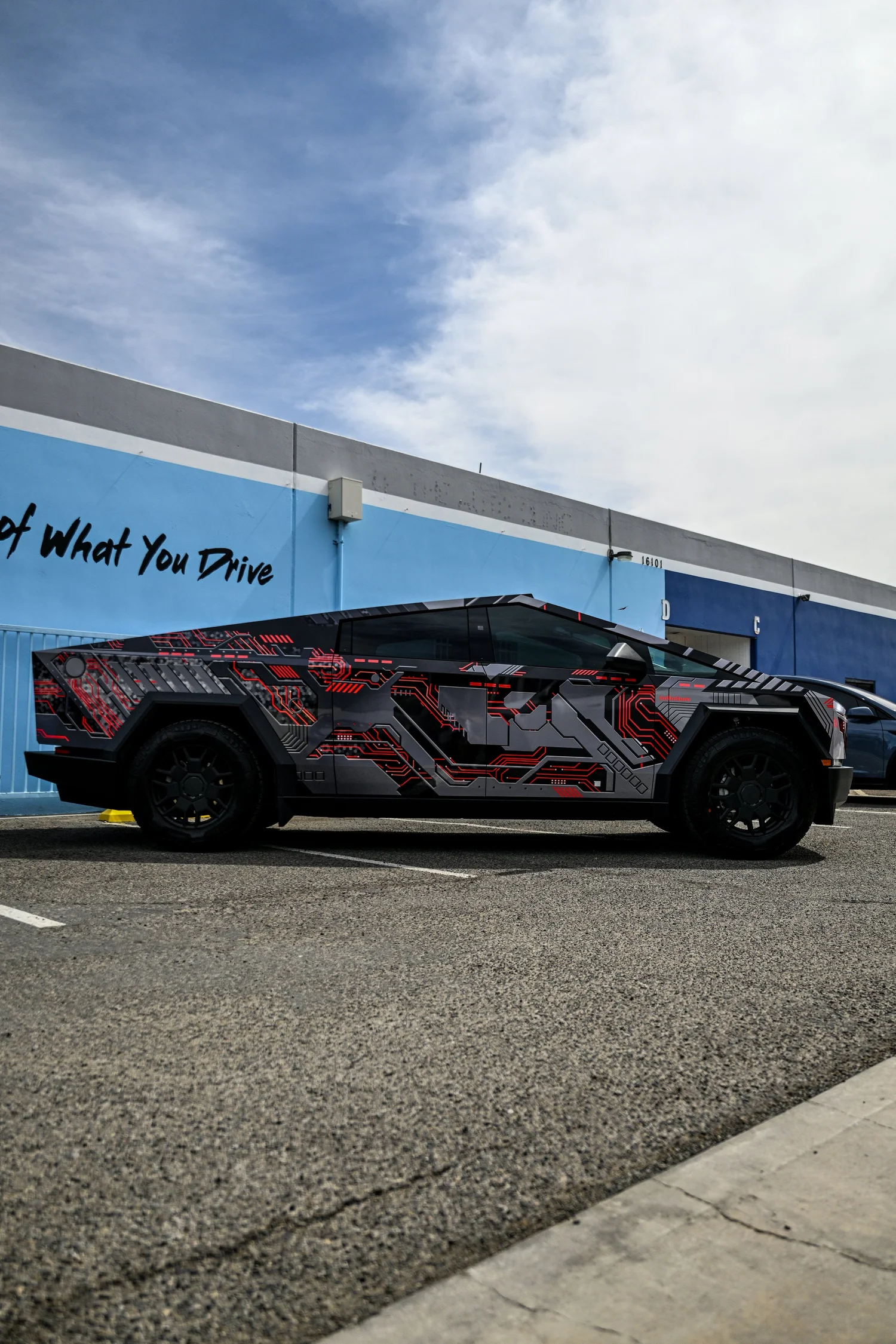 Full side view of Tesla Cybertruck mecha-inspired custom vinyl wrap