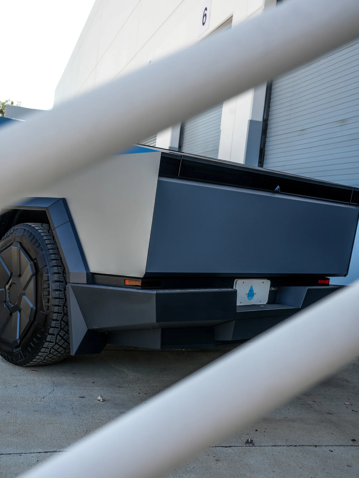 Tesla Cybertruck Ghost Metal Grey Blue after Window Tint and Vinyl Wrap, rear diffuser and exhaust detail
