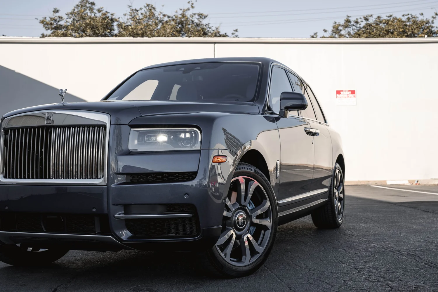 Dark Blue Rolls-Royce Cullinan after Paint Protection Film (PPF), Window Tint and Ceramic Coating, front wheel and body view