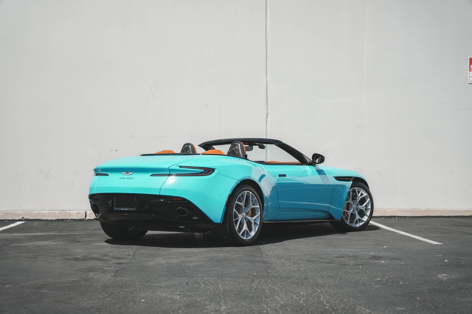 Aston Martin DB11 Miami Blue after Vinyl Wrap, rear-right three-quarter view