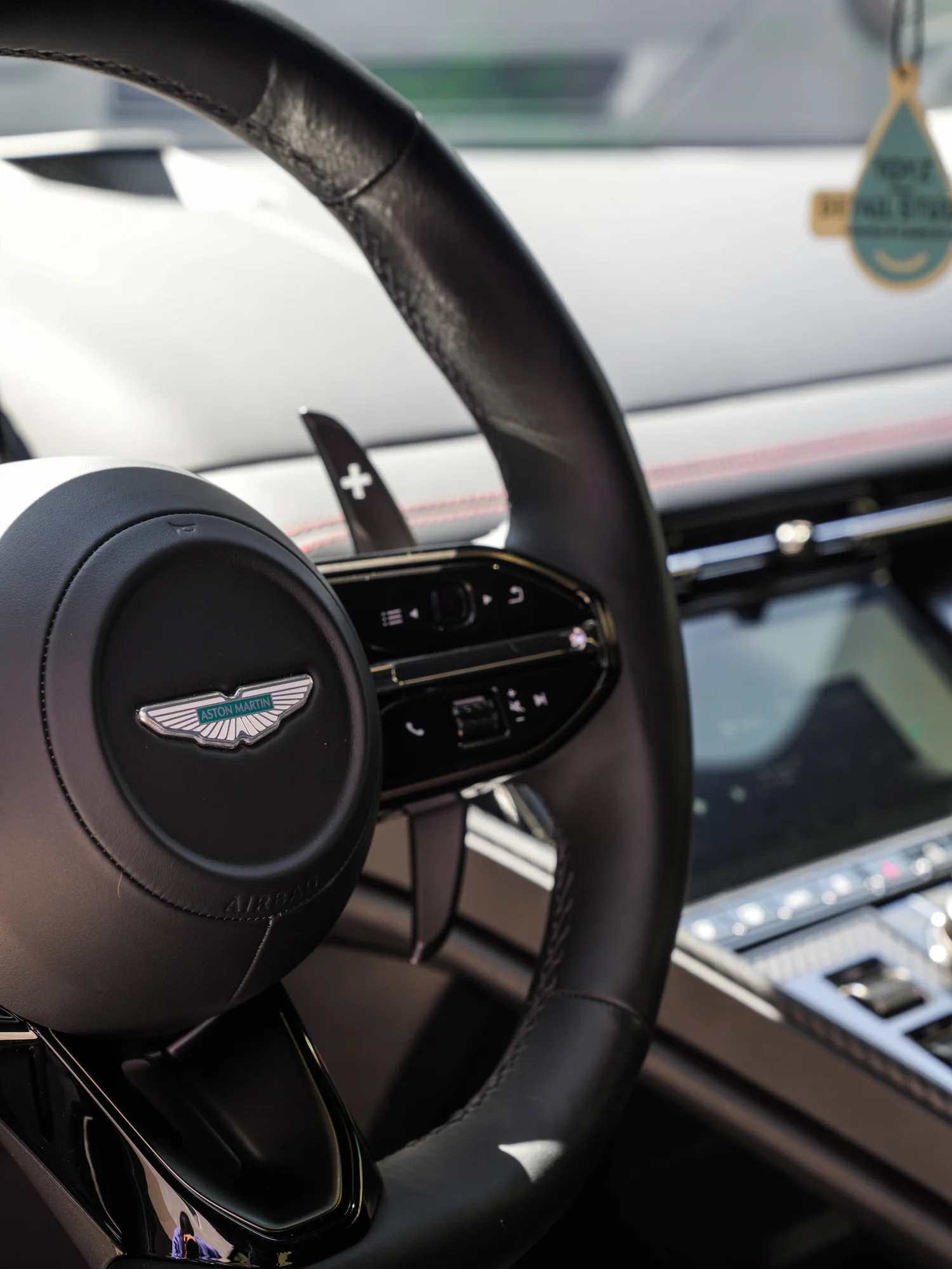 Aston Martin DB12 steering wheel and dashboard after full exterior PPF, window tint and ceramic coating