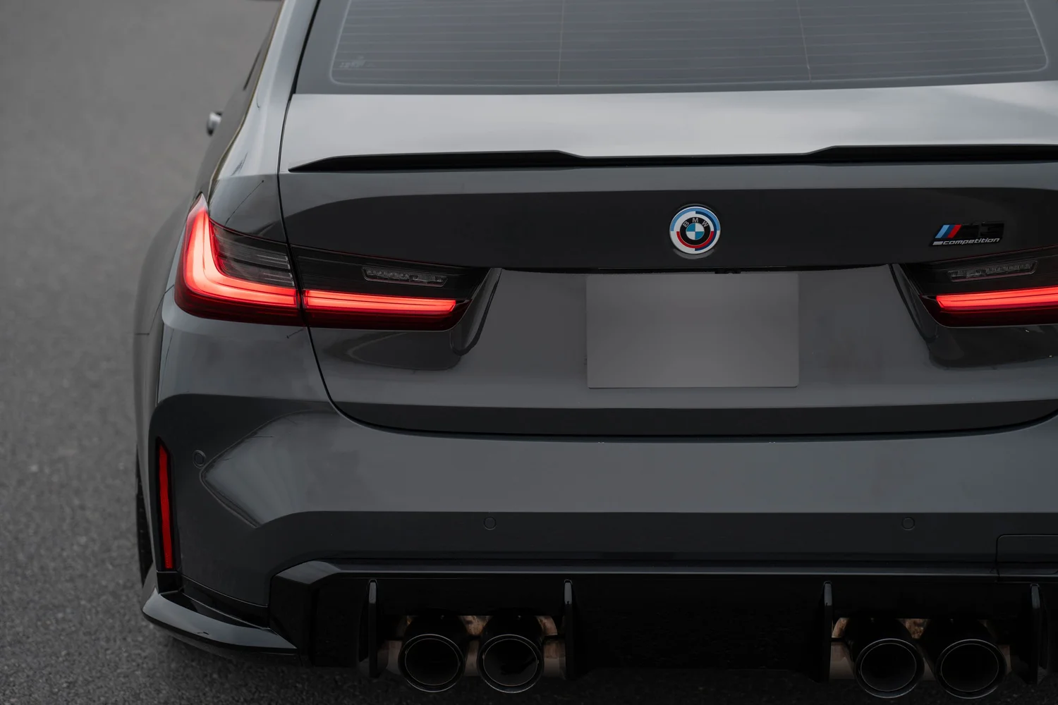 Dravit Grey BMW M3 after Paint Protection Film (PPF), Window Tint and Ceramic Coating, rear diffuser and exhaust detail