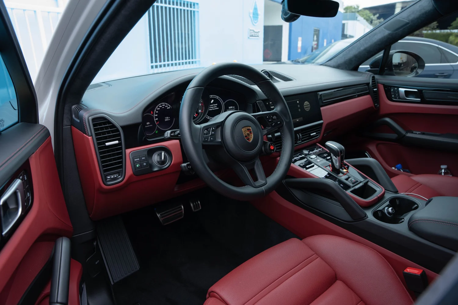 Porsche Cayenne Turbo GT red leather cockpit and steering wheel after PPF, window tint and ceramic coating