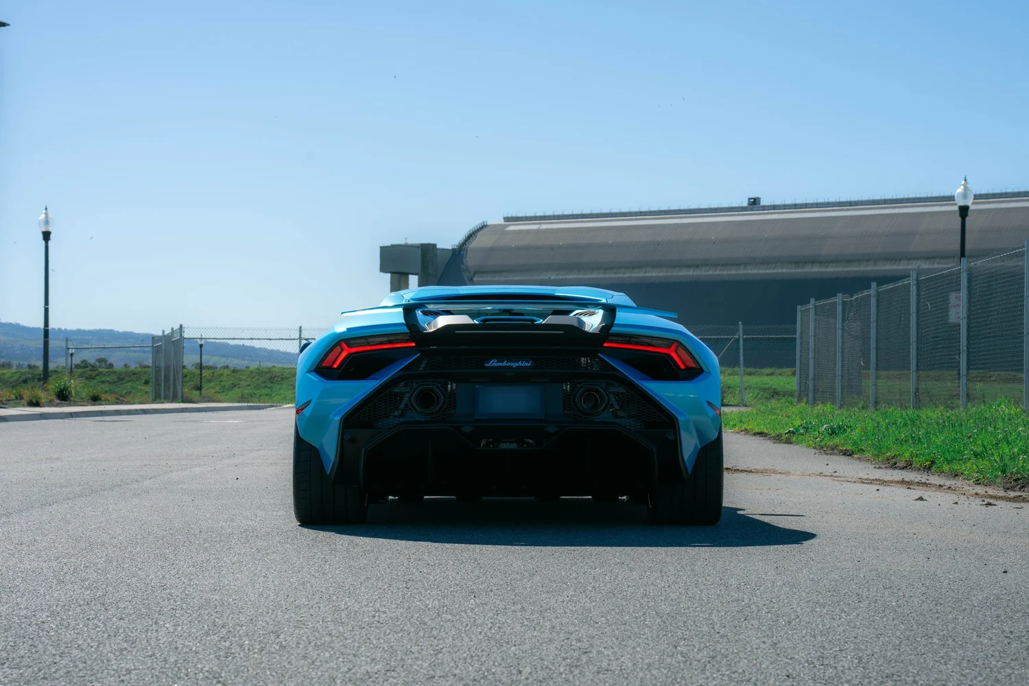 Lamborghini Huracán Tecnica after Paint Protection Film (PPF) and Vinyl Wrap, low-angle rear view