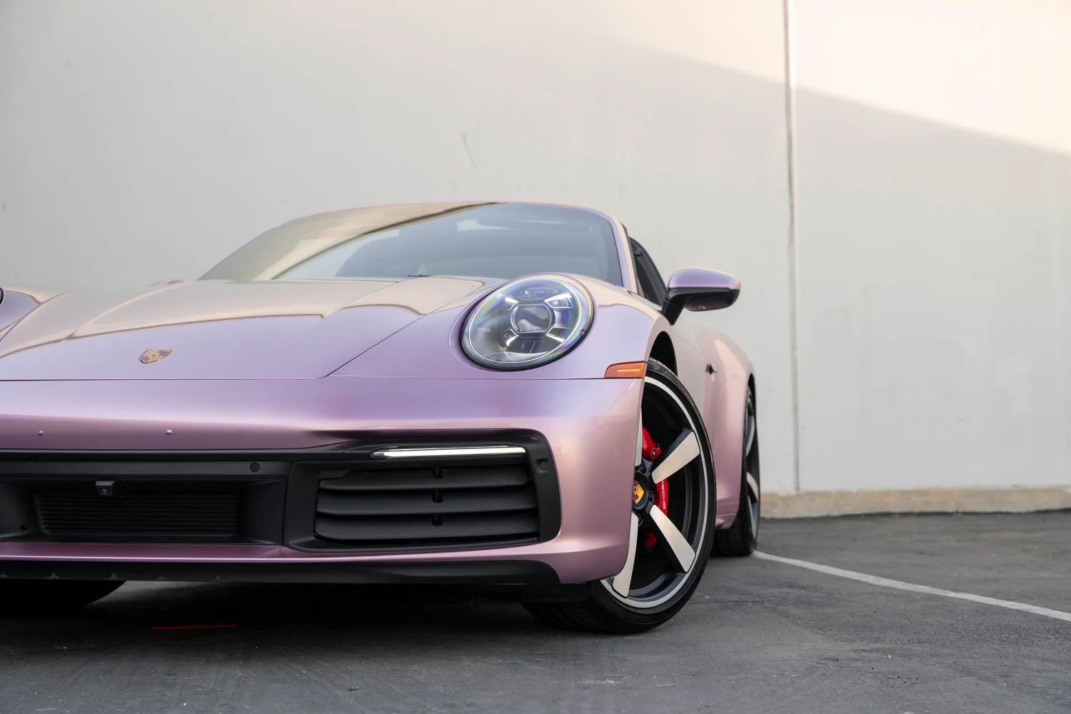 Porsche 911 Metallic Pink after Vinyl Wrap, front wheel and body view