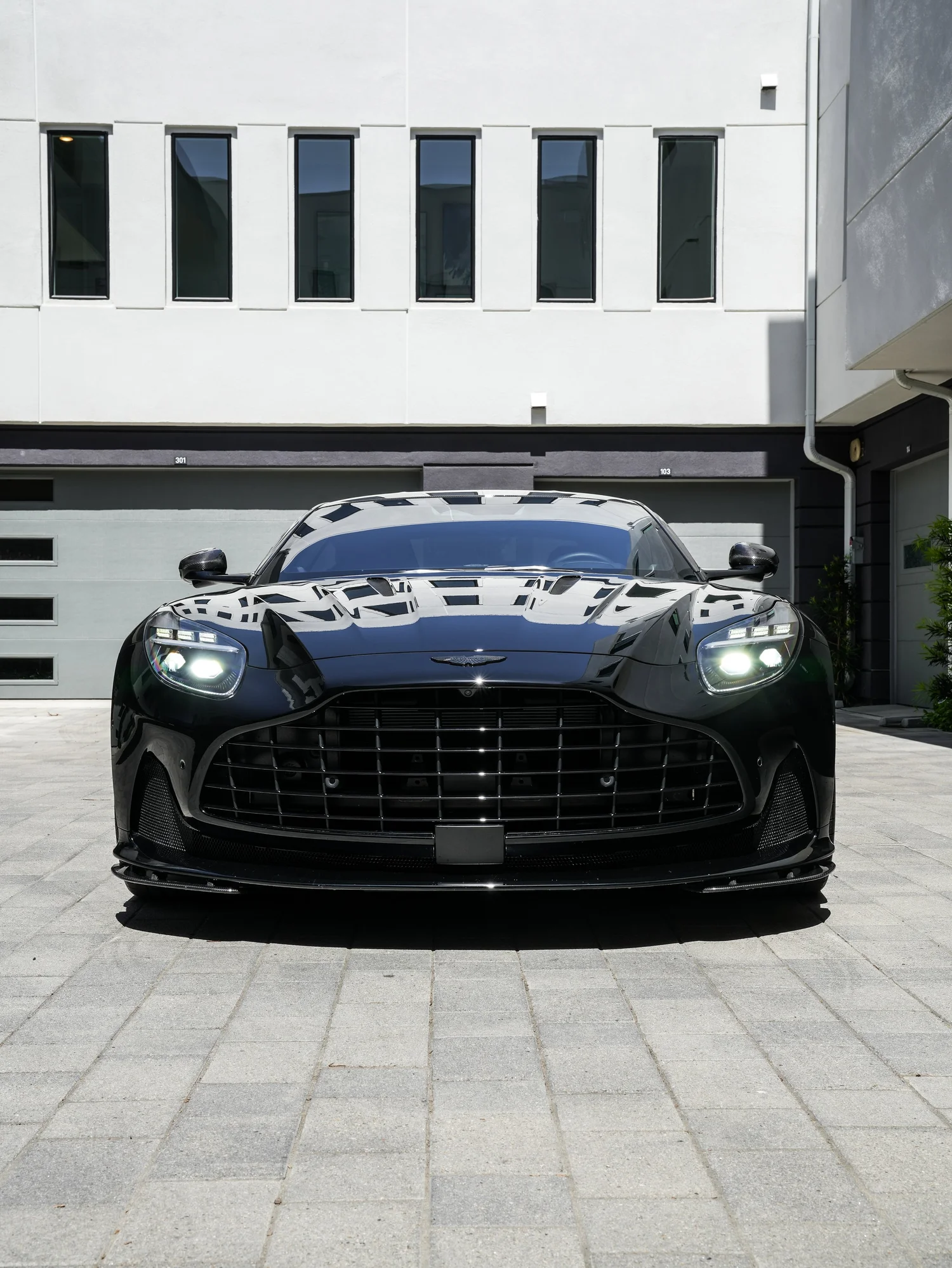 Aston Martin DB12 head-on front view after full exterior PPF, window tint and ceramic coating