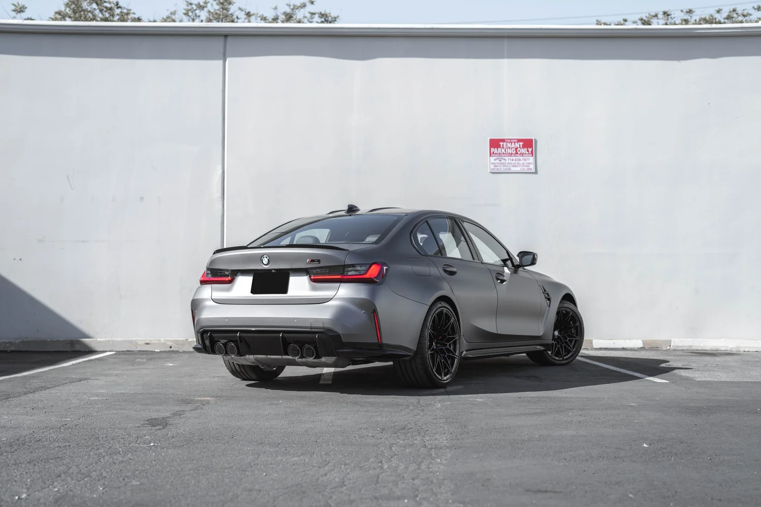 BMW M3 Matte Grey after Vinyl Wrap, rear-left three-quarter view