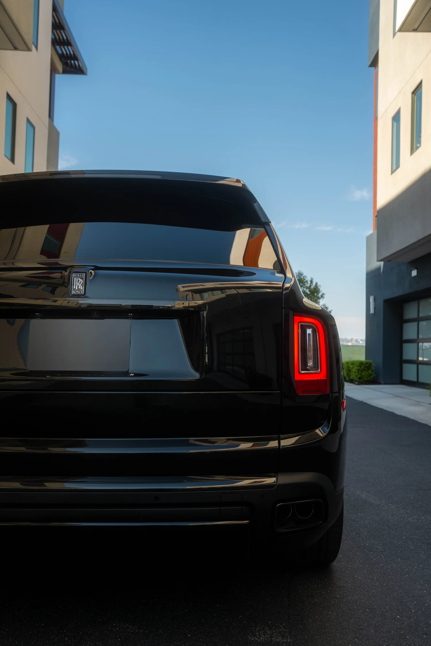 Black Rolls-Royce Cullinan Black Badge with Two-Tone Wheels after Paint Protection Film (PPF), Window Tint and Ceramic Coating, close rear view
