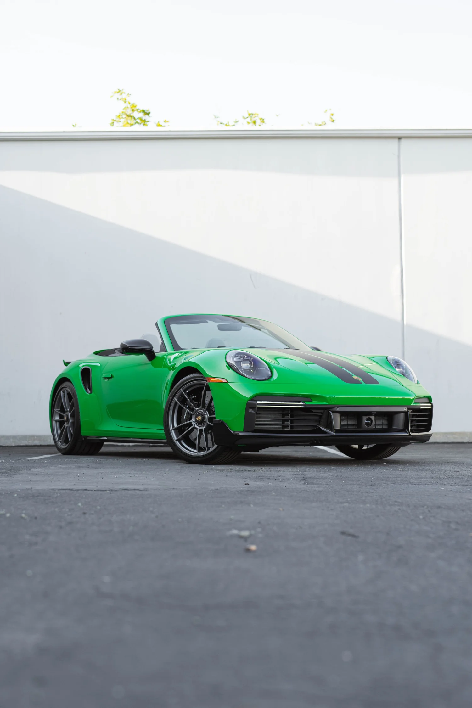 Signal Green Porsche 911 Turbo S after Paint Protection Film (PPF), Window Tint and Ceramic Coating, low-angle front view