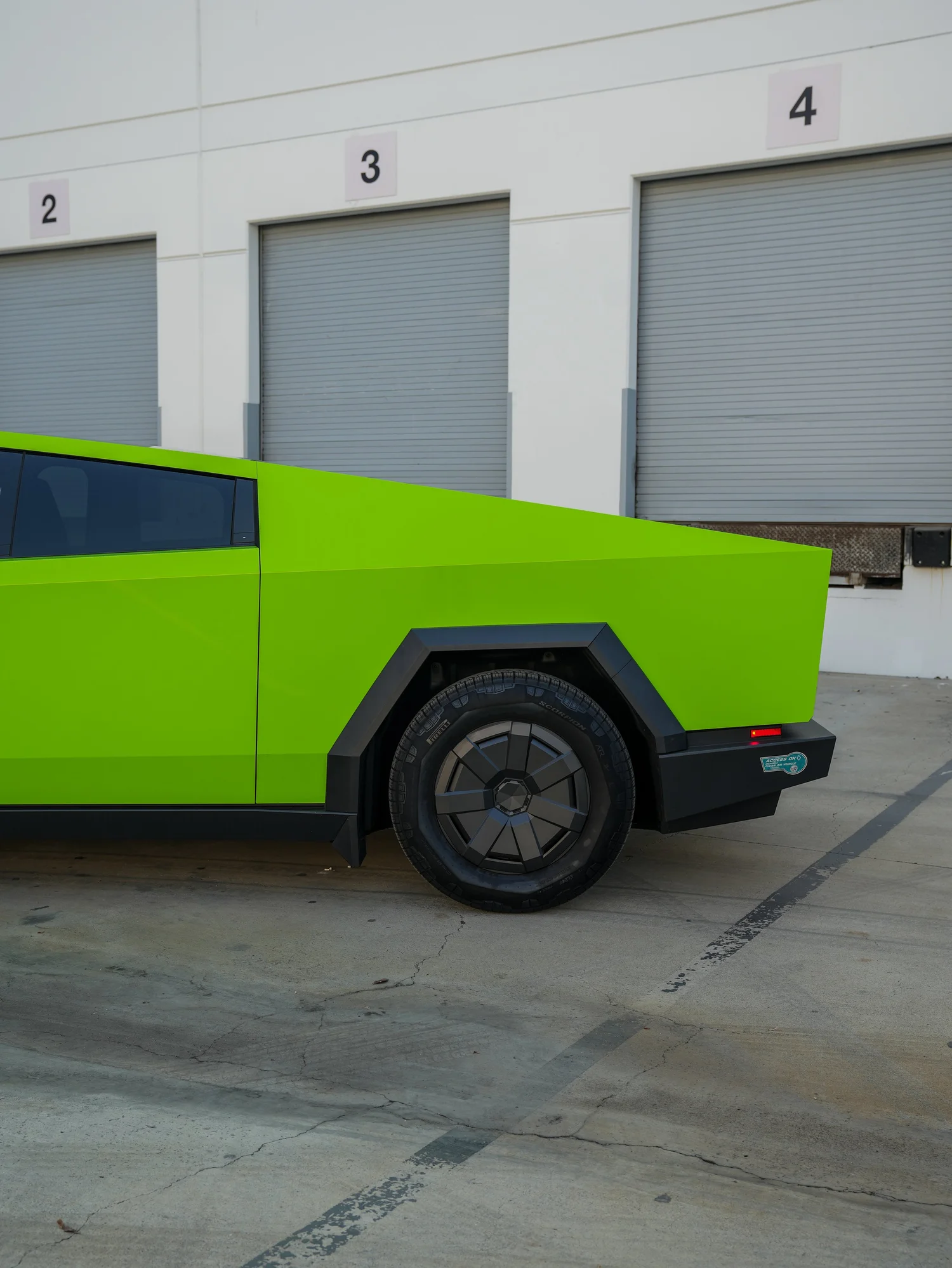 Tesla Cybertruck 3M Gloss Green after Vinyl Wrap, rear-quarter and wheel view