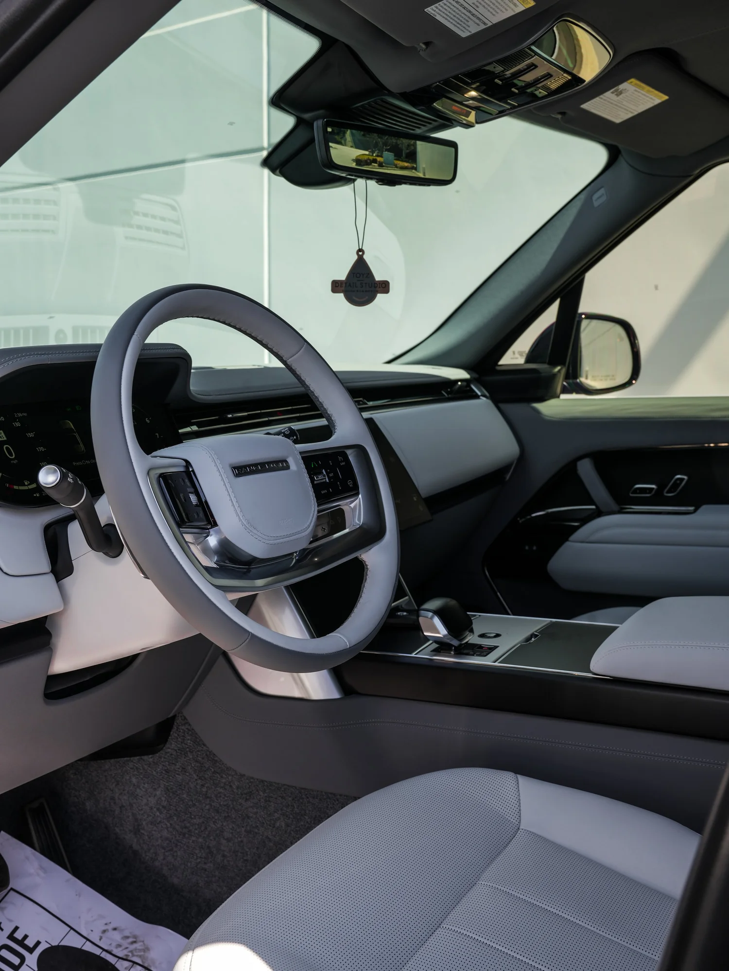 Range Rover SV light interior cockpit and steering wheel after full exterior PPF, window tint and ceramic coating