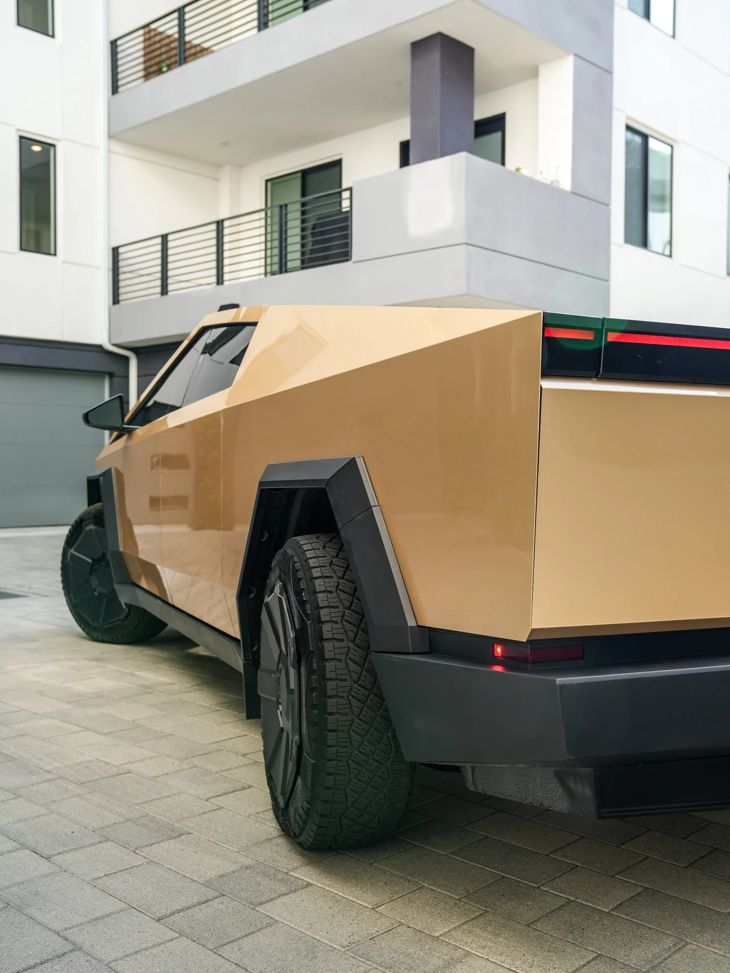 Tesla Cybertruck Milan Gold after Paint Protection Film (PPF) and Window Tint, rear-right three-quarter view