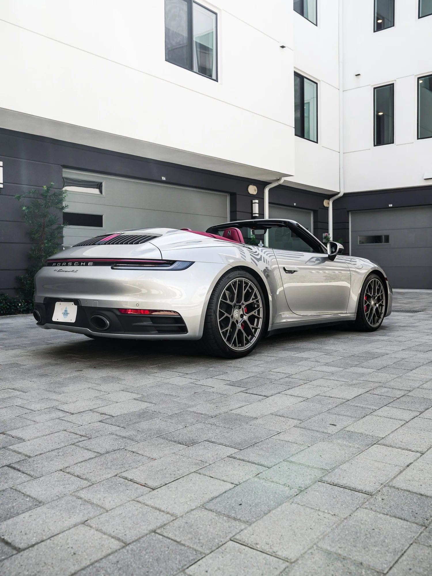 Porsche 911 after Paint Protection Film (PPF), rear-left three-quarter view