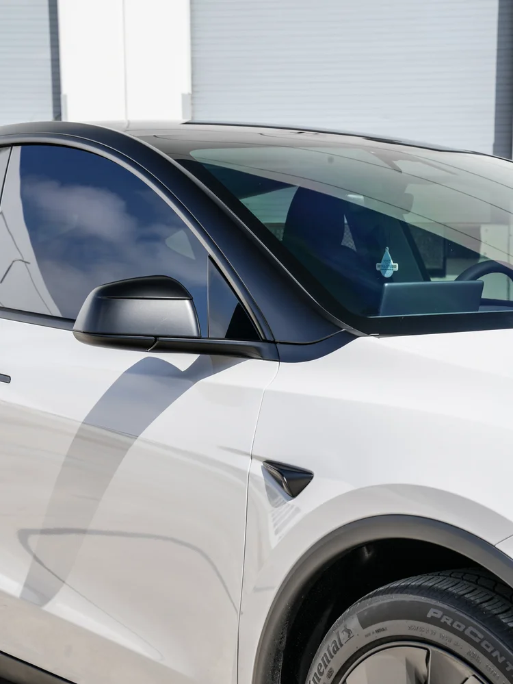 Chalk Grey Model Y black mirror and roofline detail
